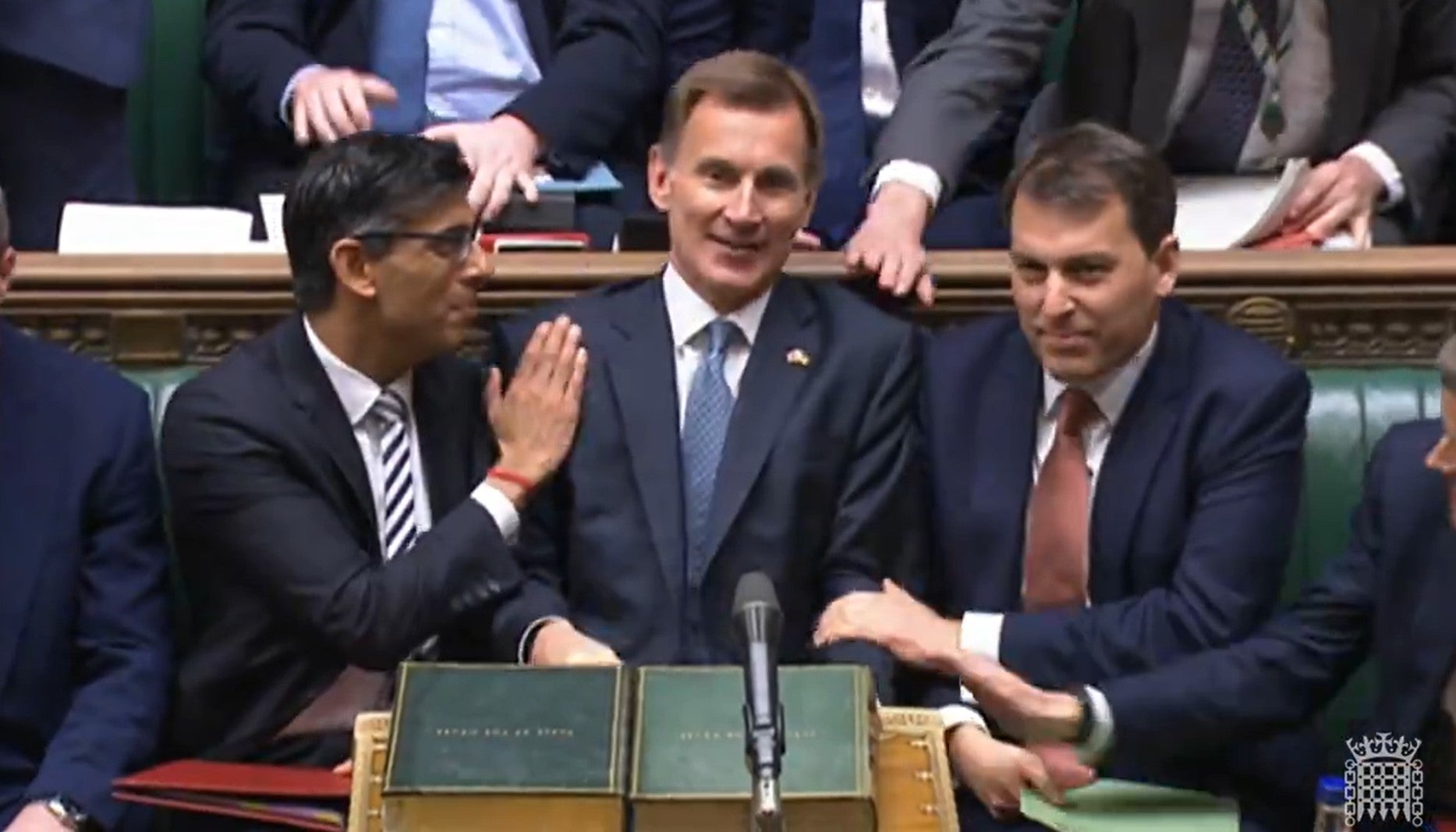 Rishi Sunak (left) congratulates Jeremy Hunt (centre) after the chancellor’s autumn statement to MPs last month