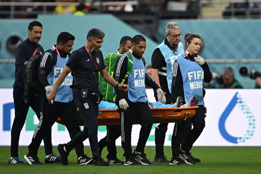 Alireza Beiranvand leaves the pitch on a stretcher