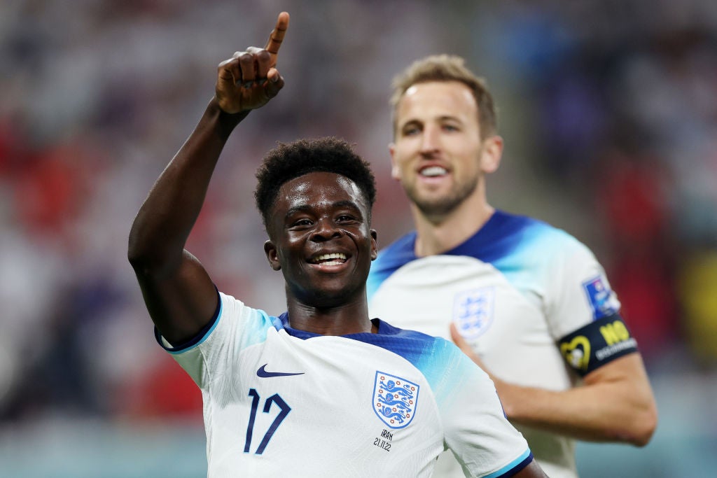 Bukayo Saka celebrates after scoring against Iran