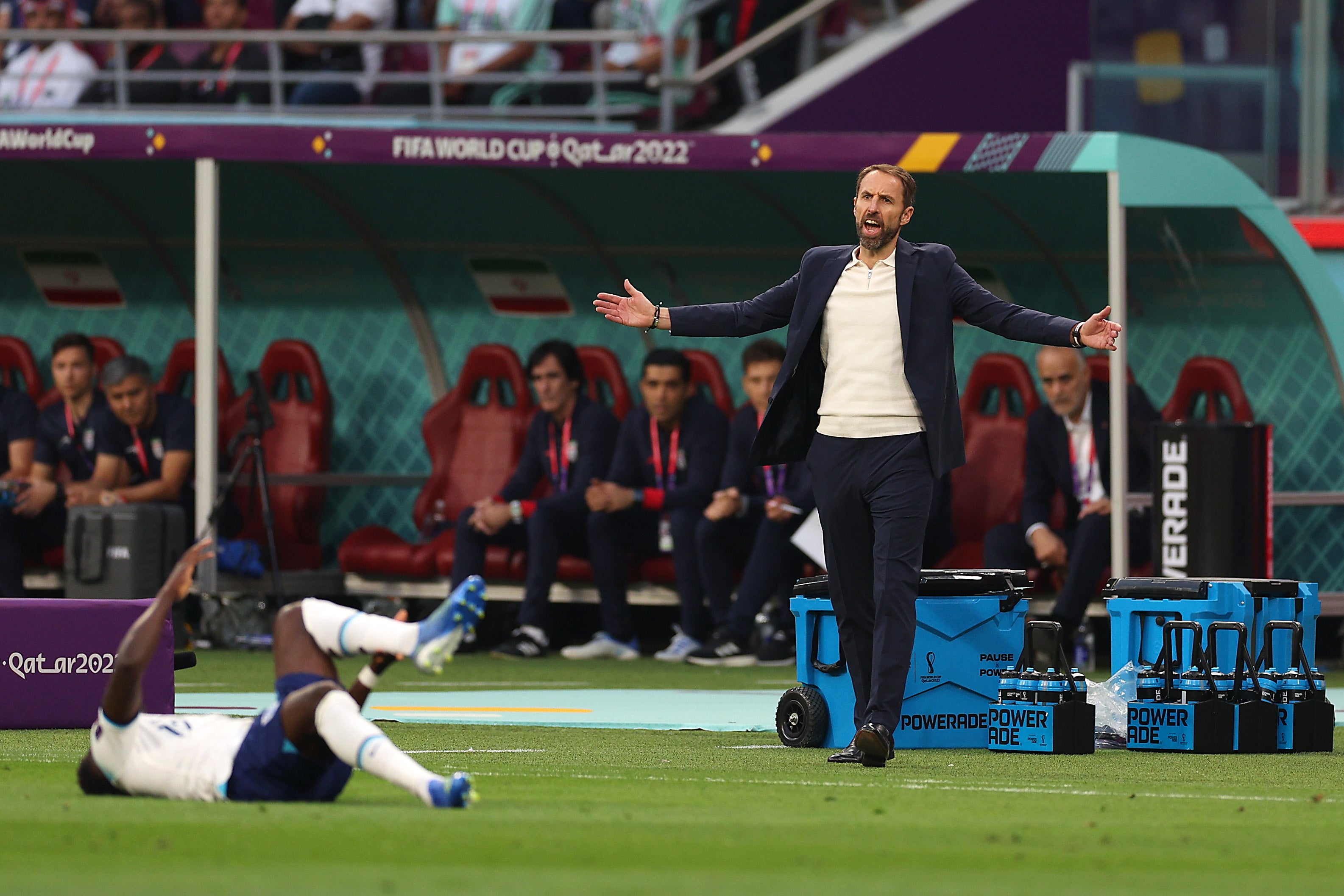 Gareth Southgate reacts as Bukayo Saka lays on the pitch