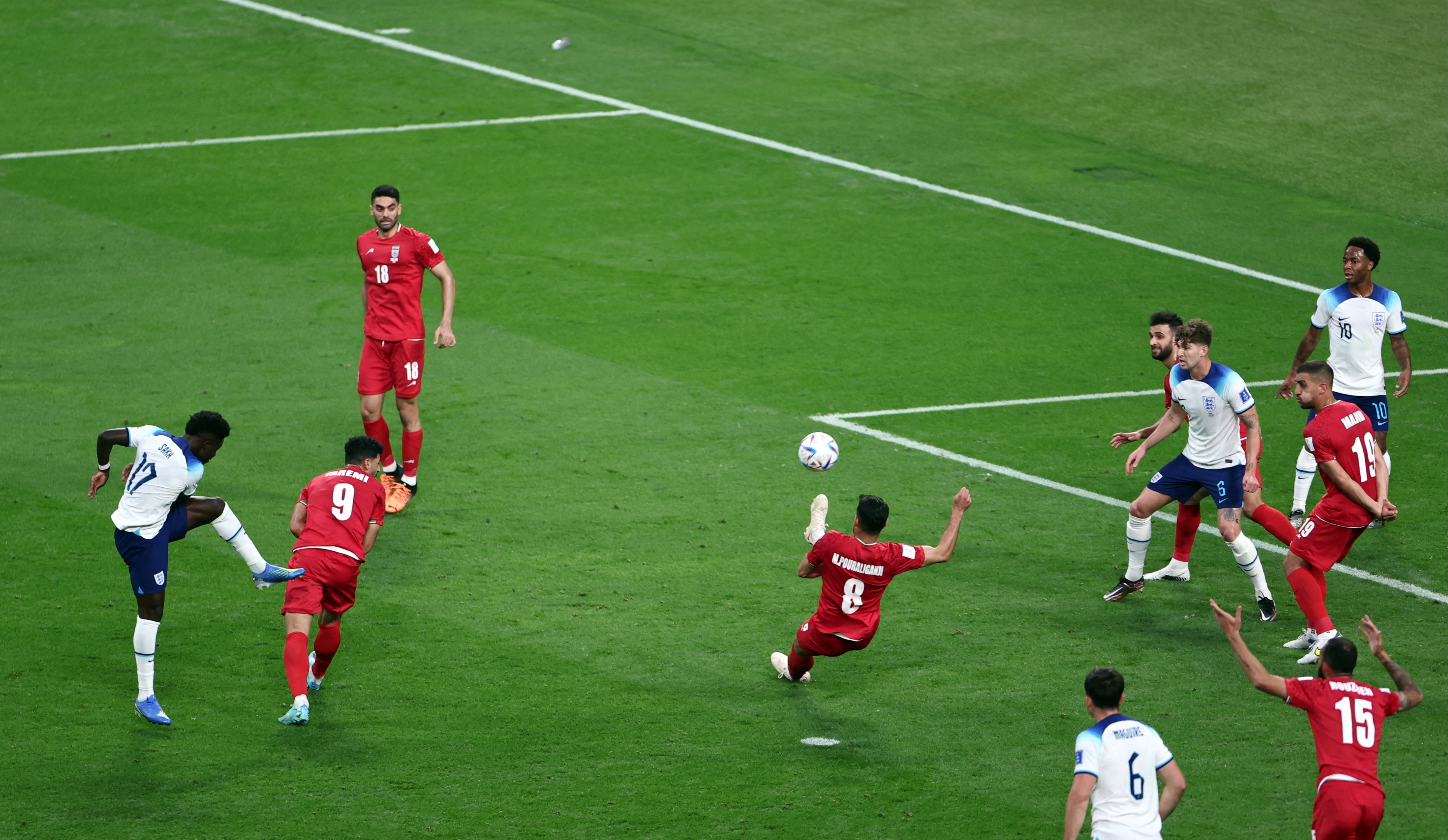 Bukayo Saka strikes the ball to score England’s second