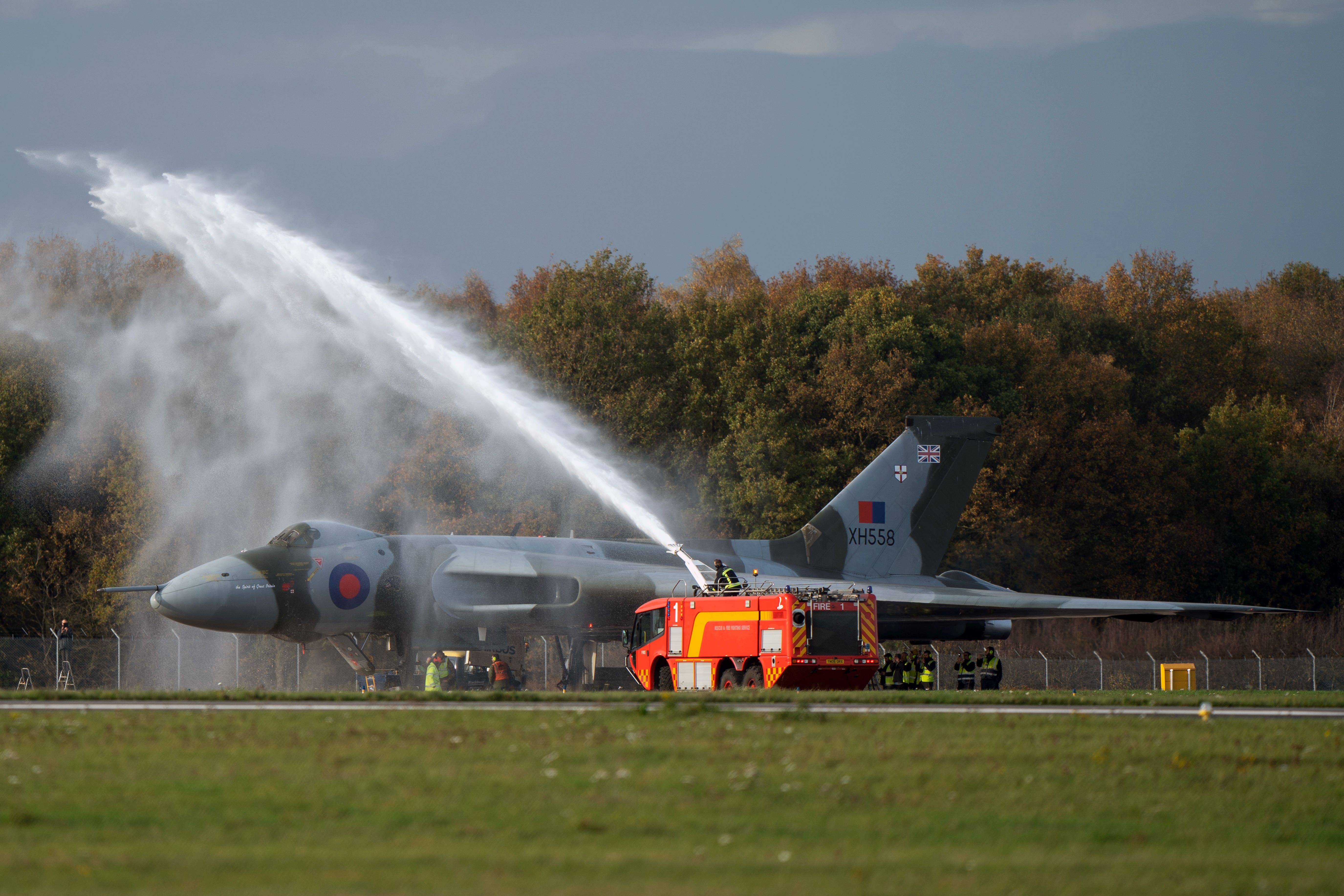 Emergency services spray Vulcan bomber XH558 after her engine run (Joe Giddens/PA)