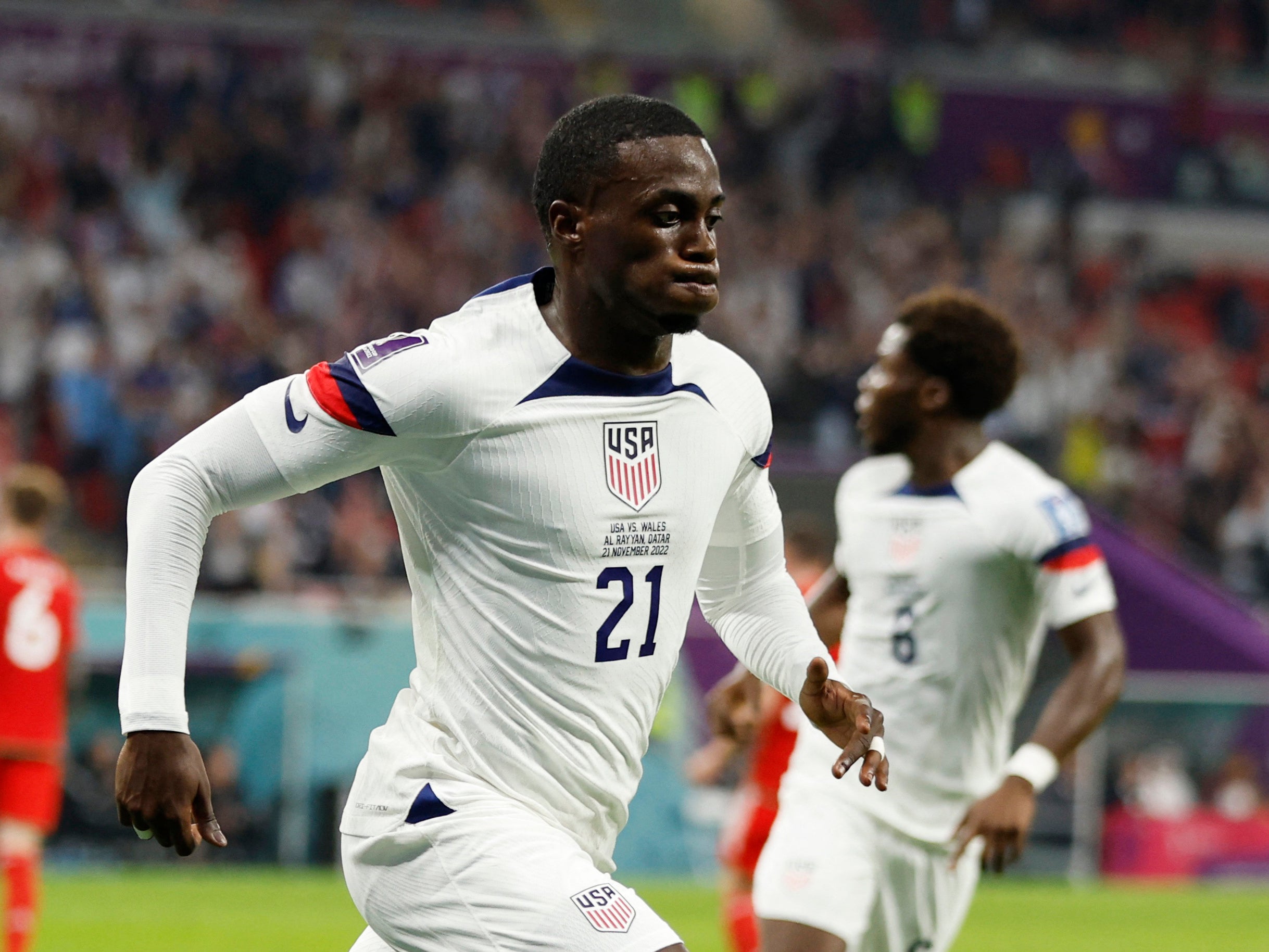 USA’s Timothy Weah celebrates after striking against Wales