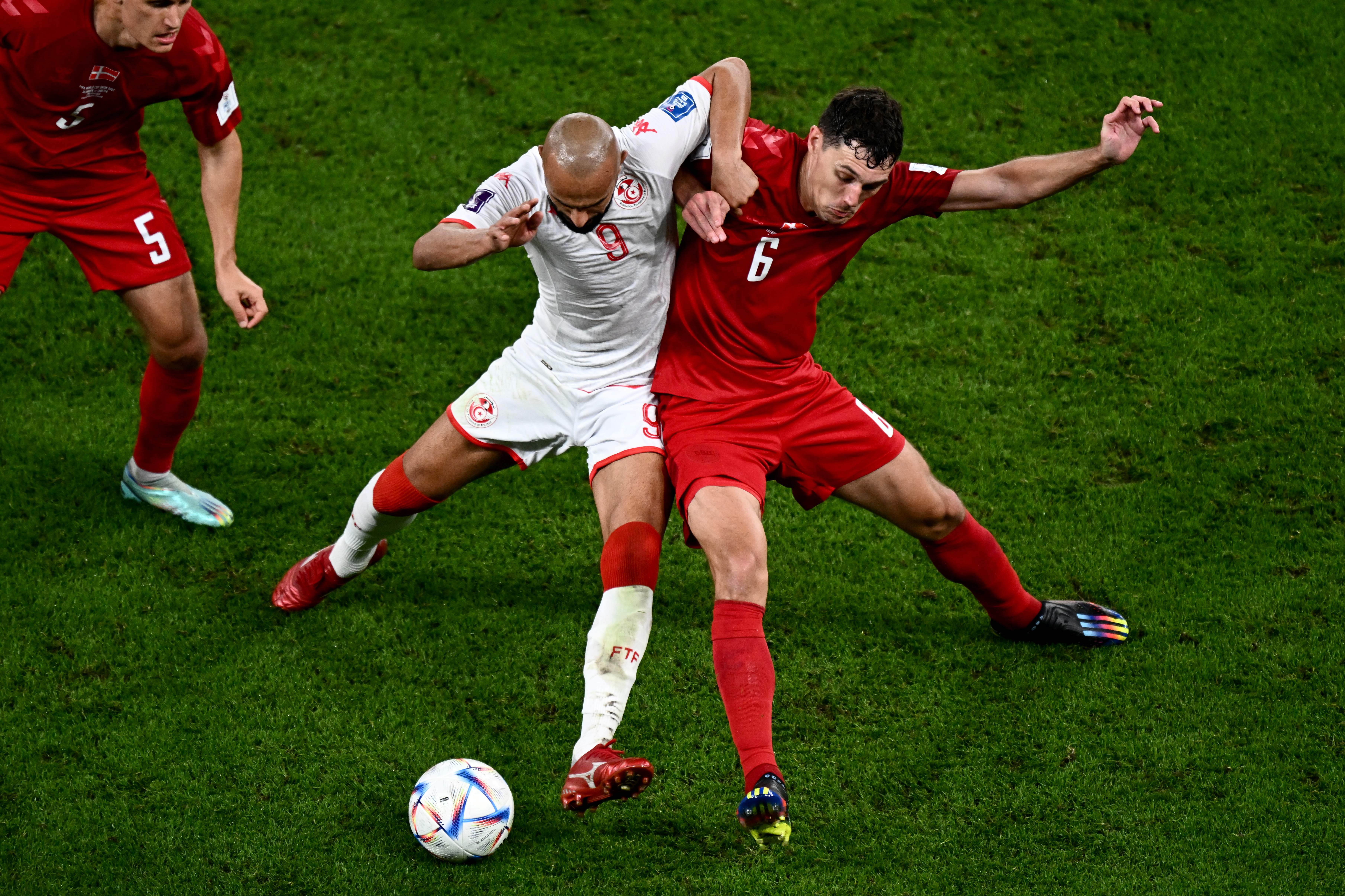 Andreas Christensen (right) vies with Issam Jebali of Tunisia