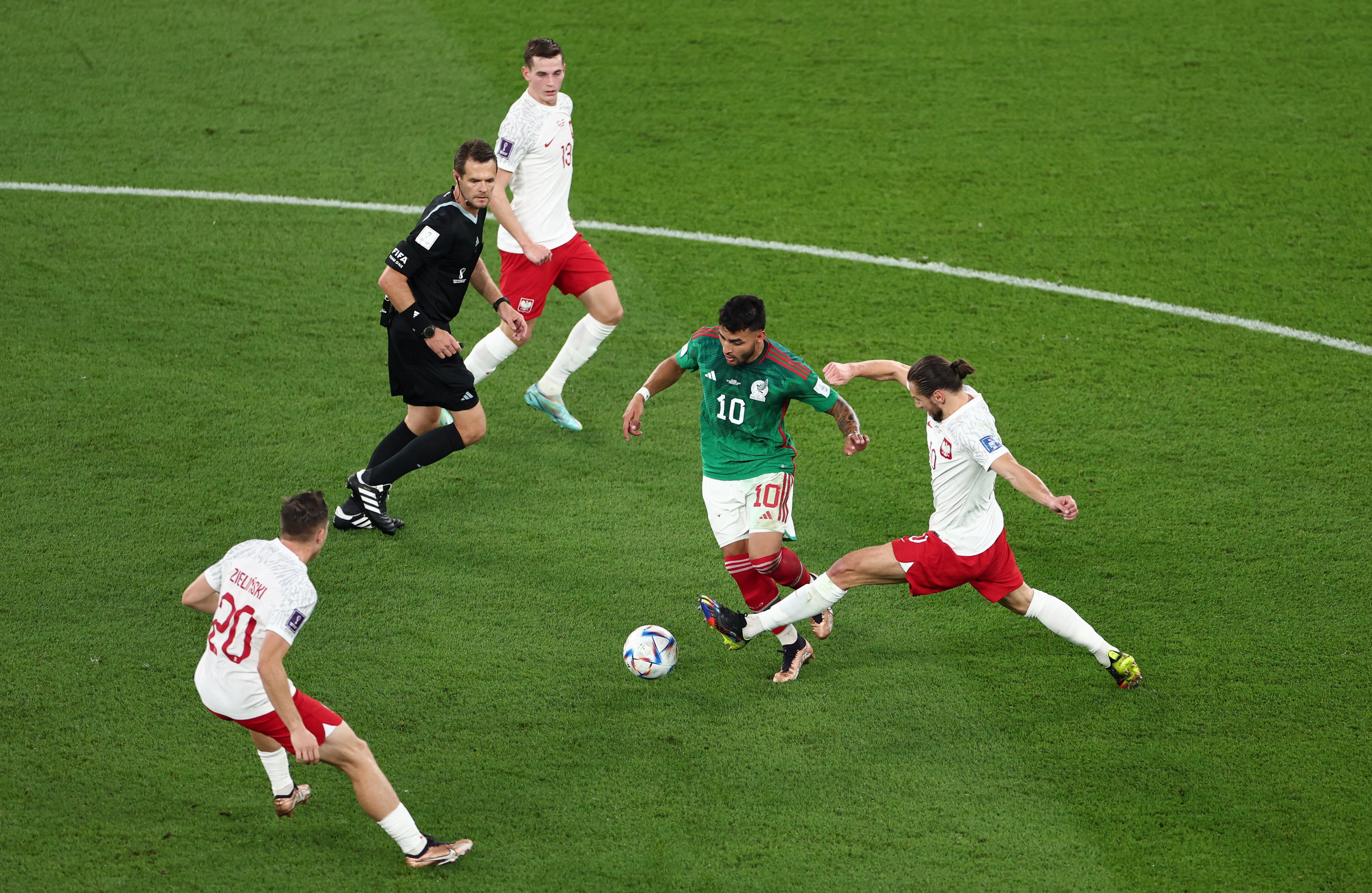 Alexis Vega on the ball for Mexico against Poland