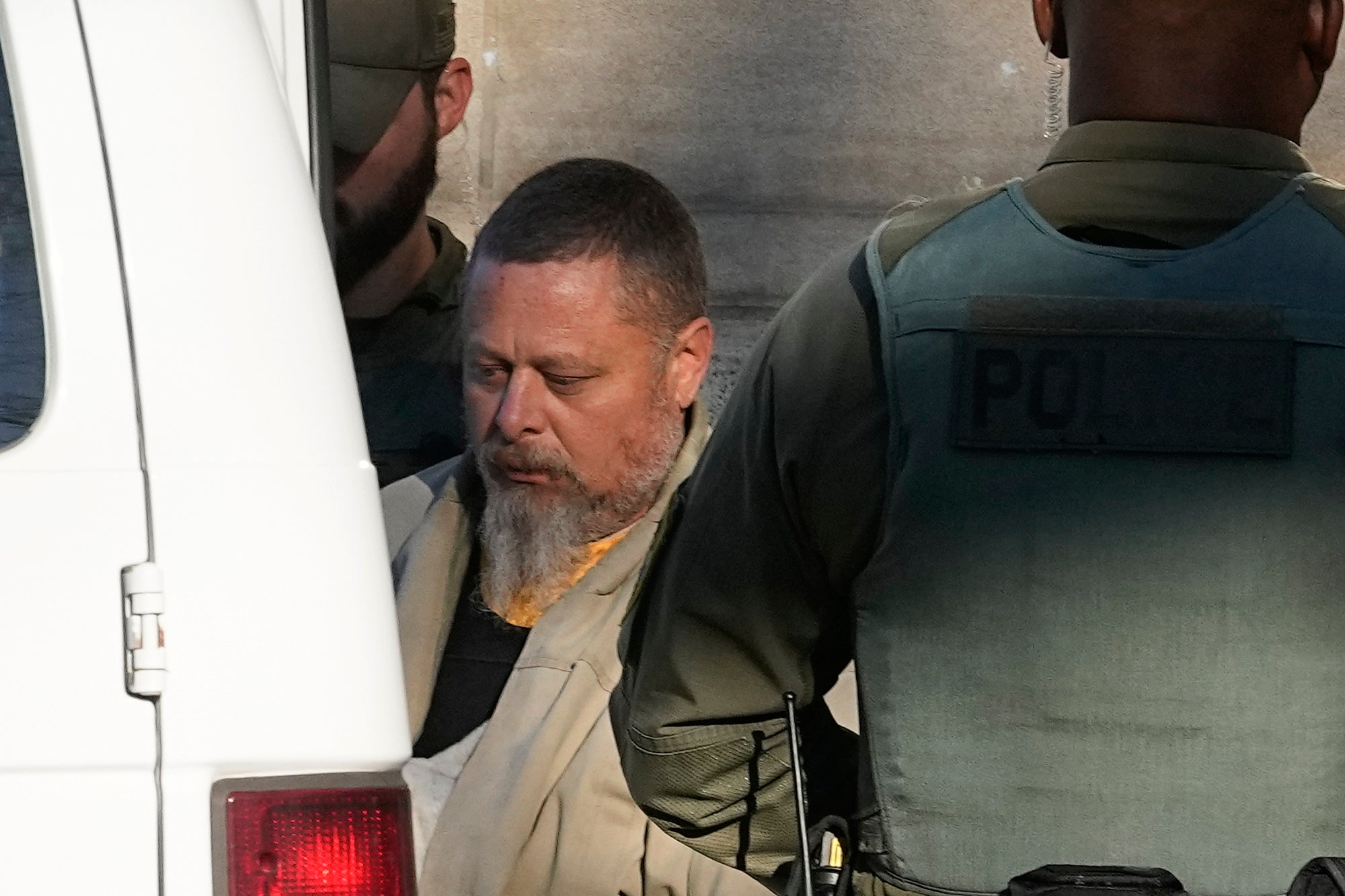 Richard Allen is escorted away from court after a hearing on 22 November