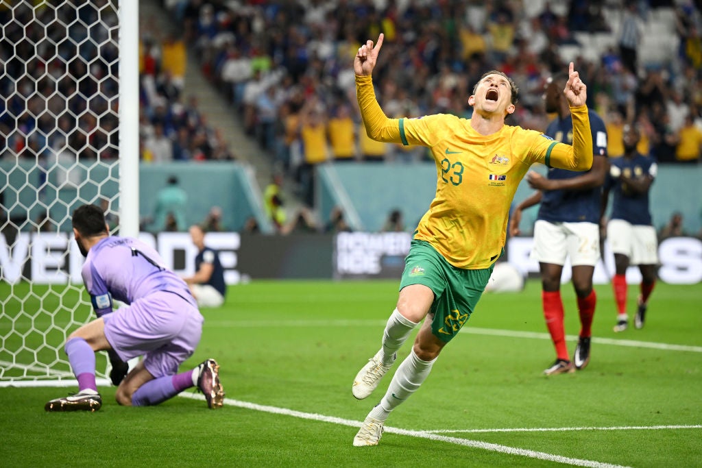 Craig Goodwin celebrates scoring Australia’s shock opening goal against France