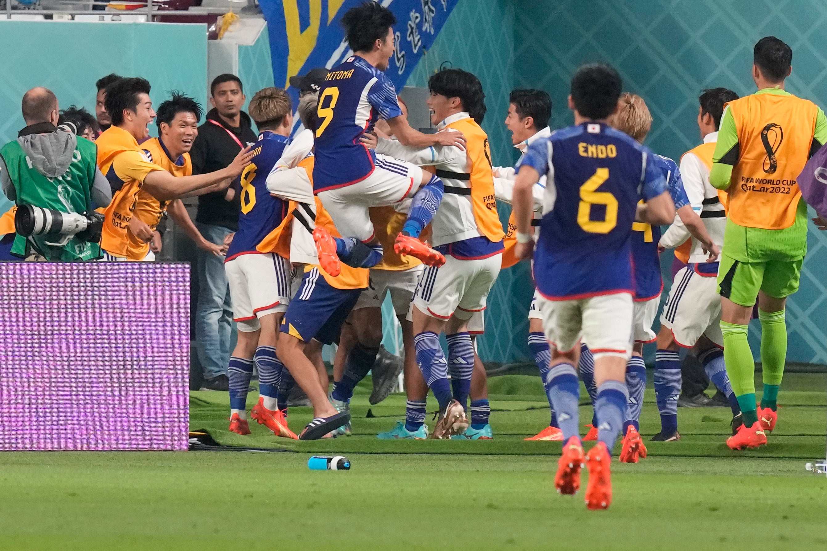 Japan’s players celebrate Takuma Asano’s winning goal