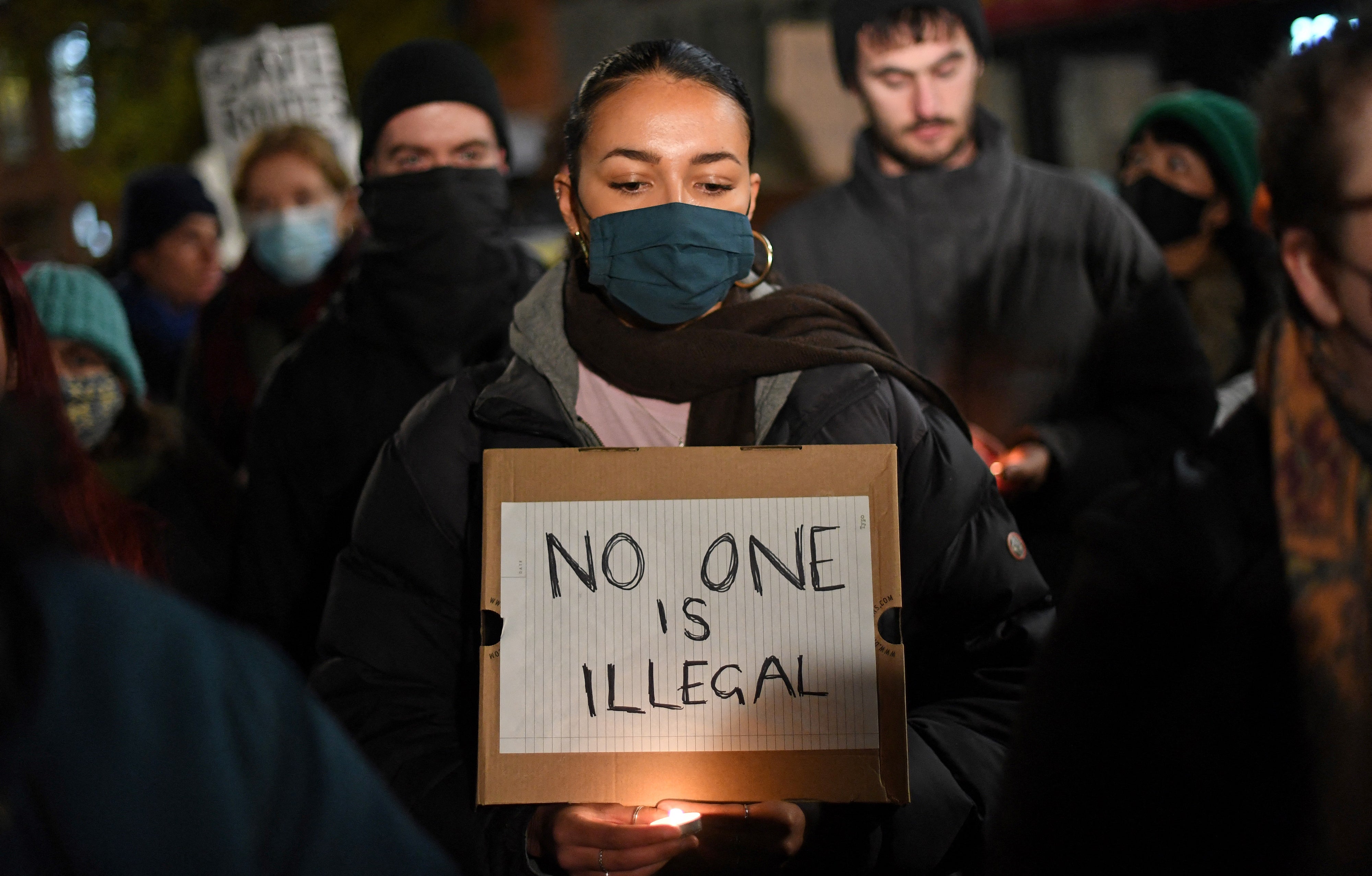 Protesters demonstrate outside of the Home Office following the death of the migrants