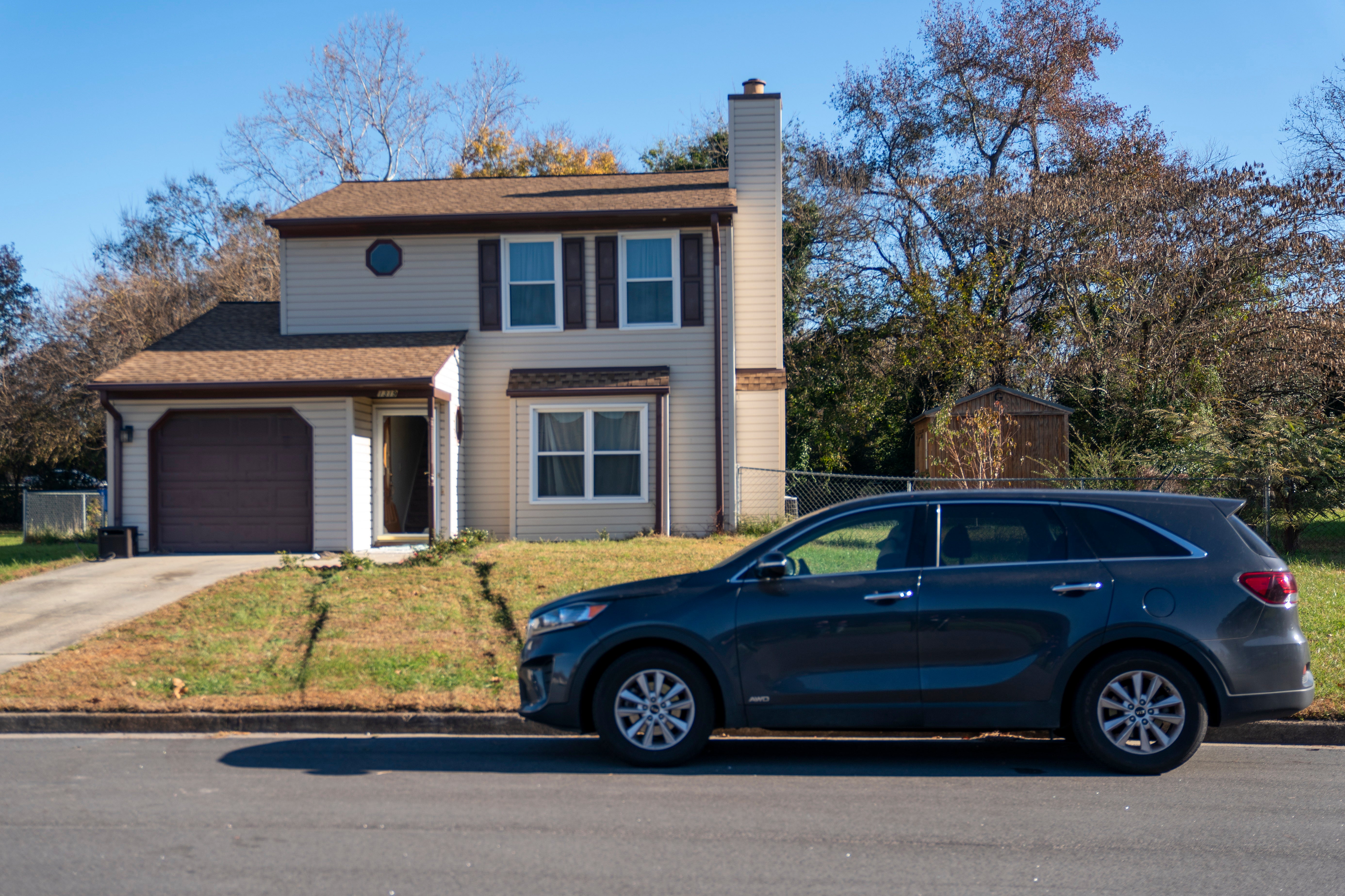 Police officers are stationed at the house where a search warrant was served in connection with the suspected shooter in the mass shooting at the Walmart Supercenter in Chesapeake, Virginia