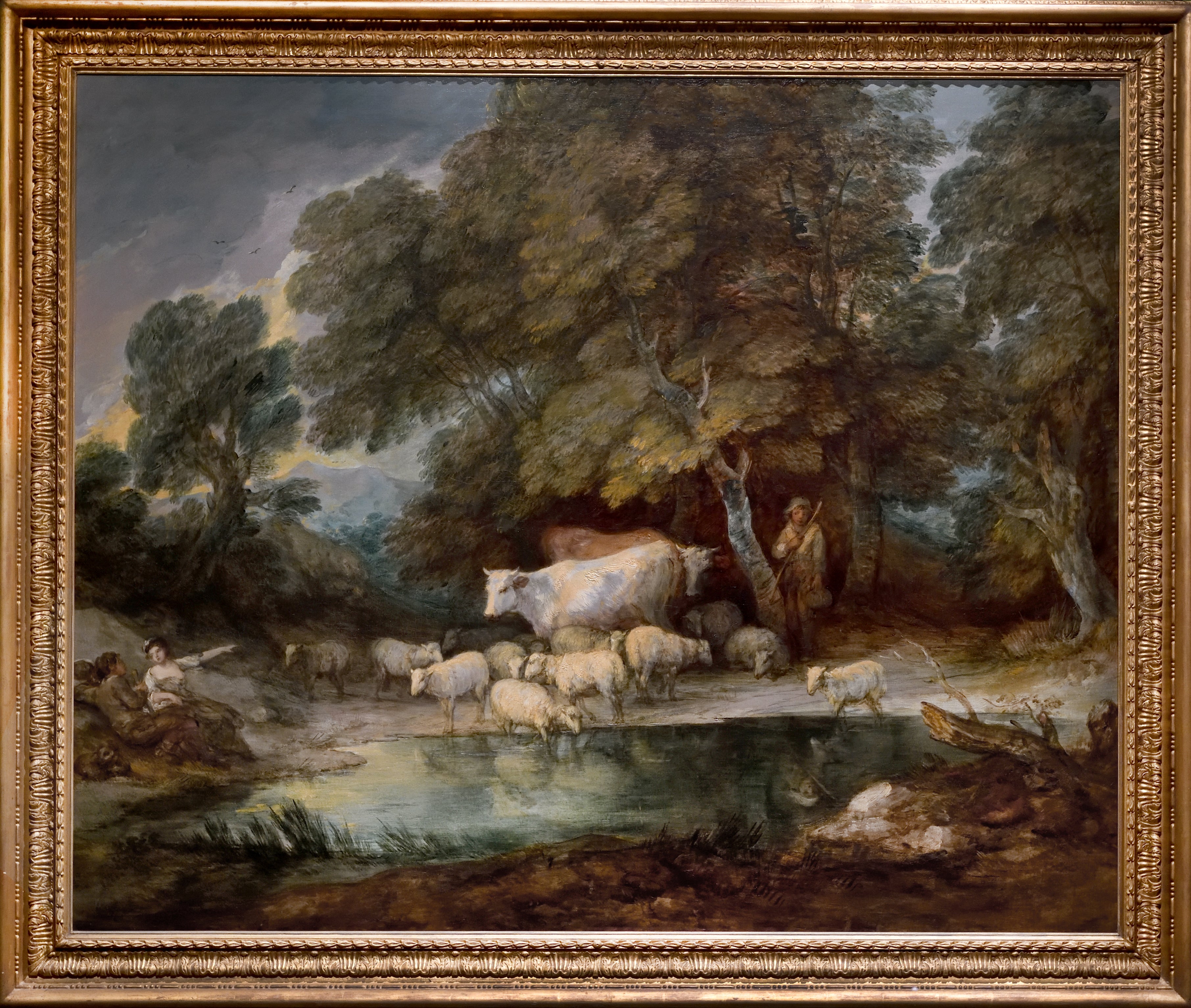 Wooded landscape with rustic lovers, herdsman, cows and flock of sheep at a pool and distant mountains, c1784-85