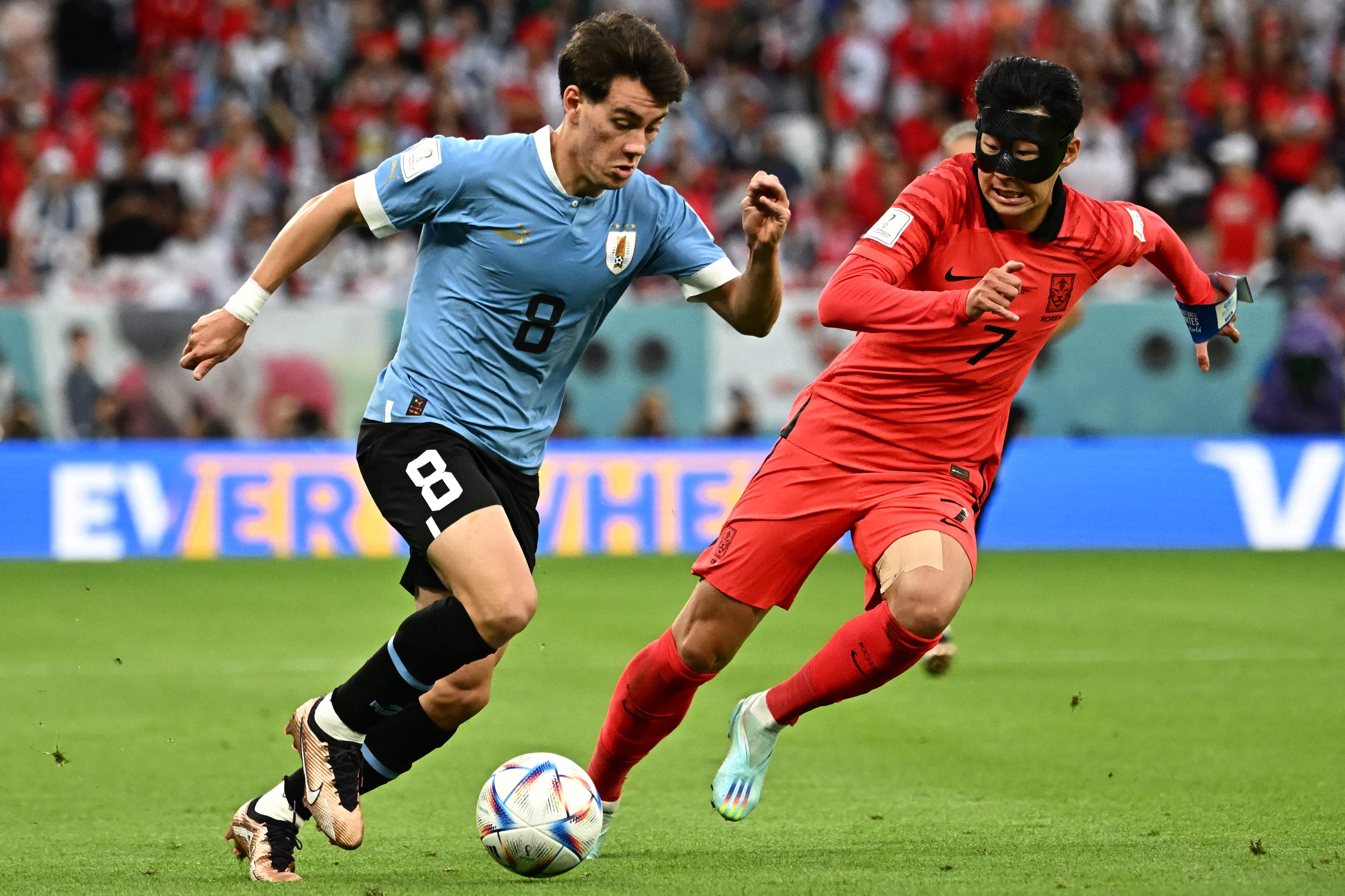 Facundo Pellistri runs with the ball past South Korea's midfielder Son Heung-min