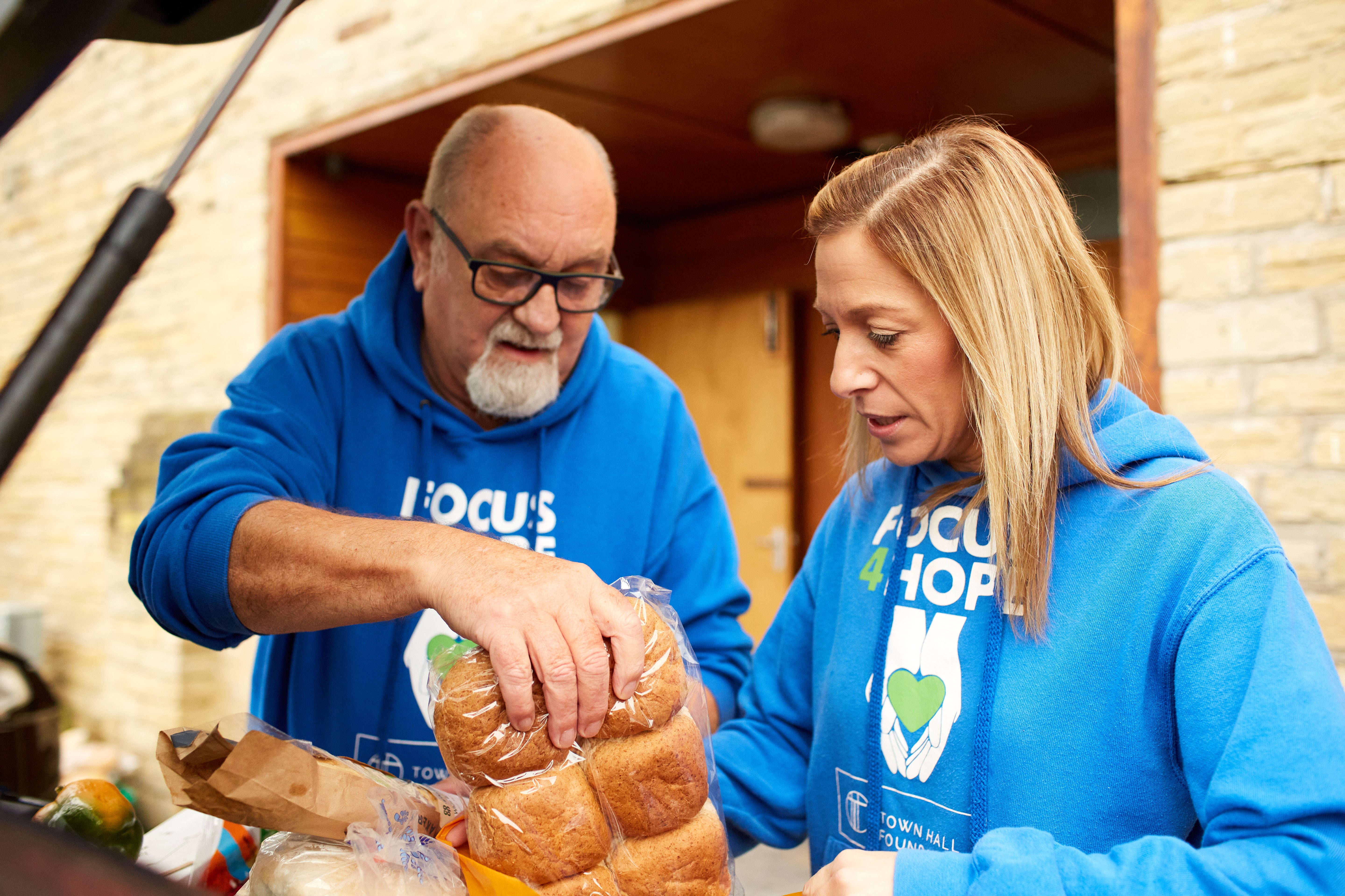 Volunteer Steve Greenwood and Louise Reed, founder and CEO of Focus4Hope