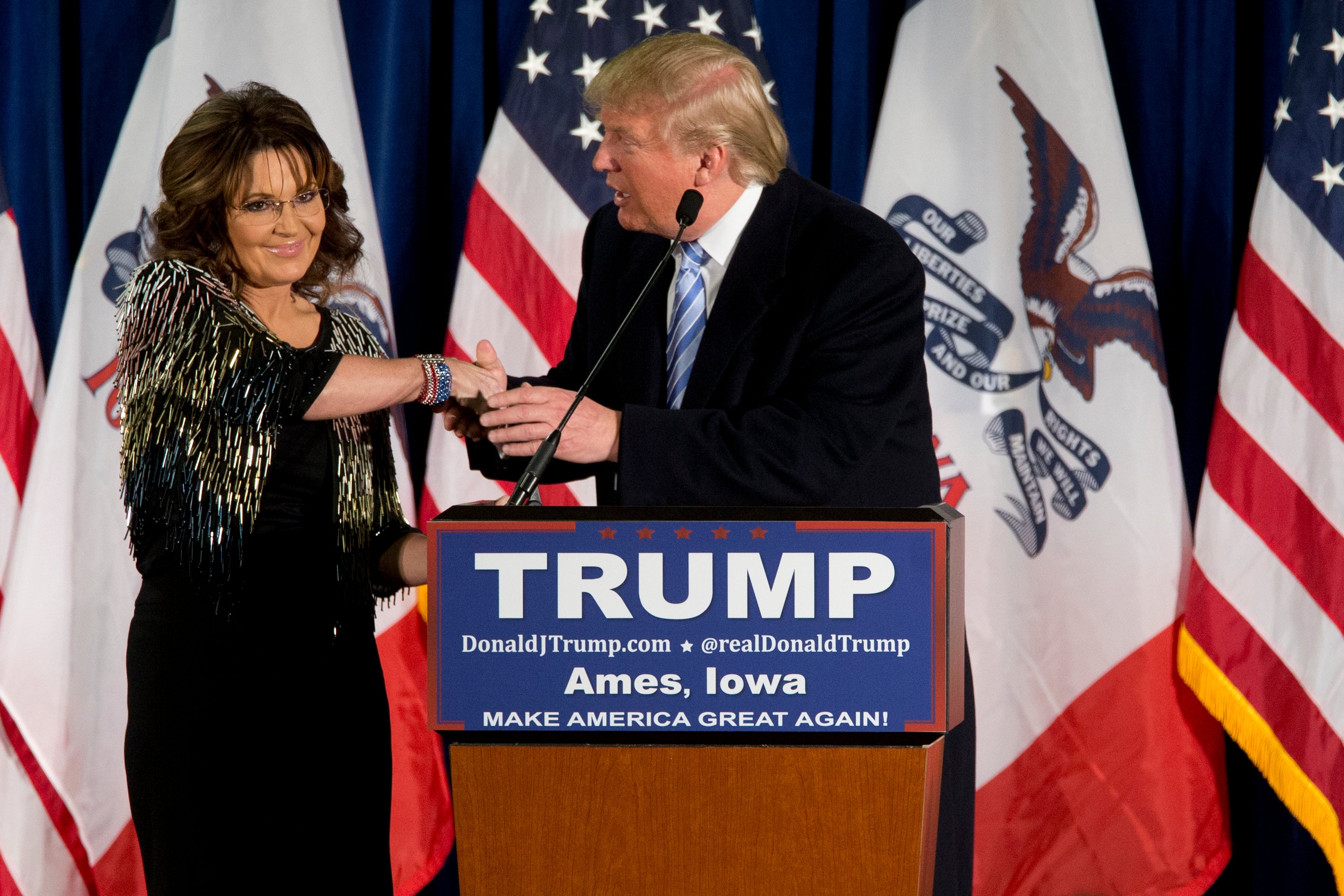 Sarah Palin and Donald Trump are pictured in Iowa in 2016