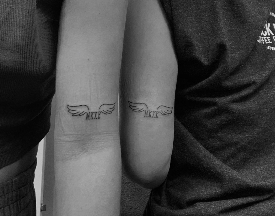 The survivor posted a picture of her ink featuring angel wings and the victims’ initials — MKXE — on VSCO