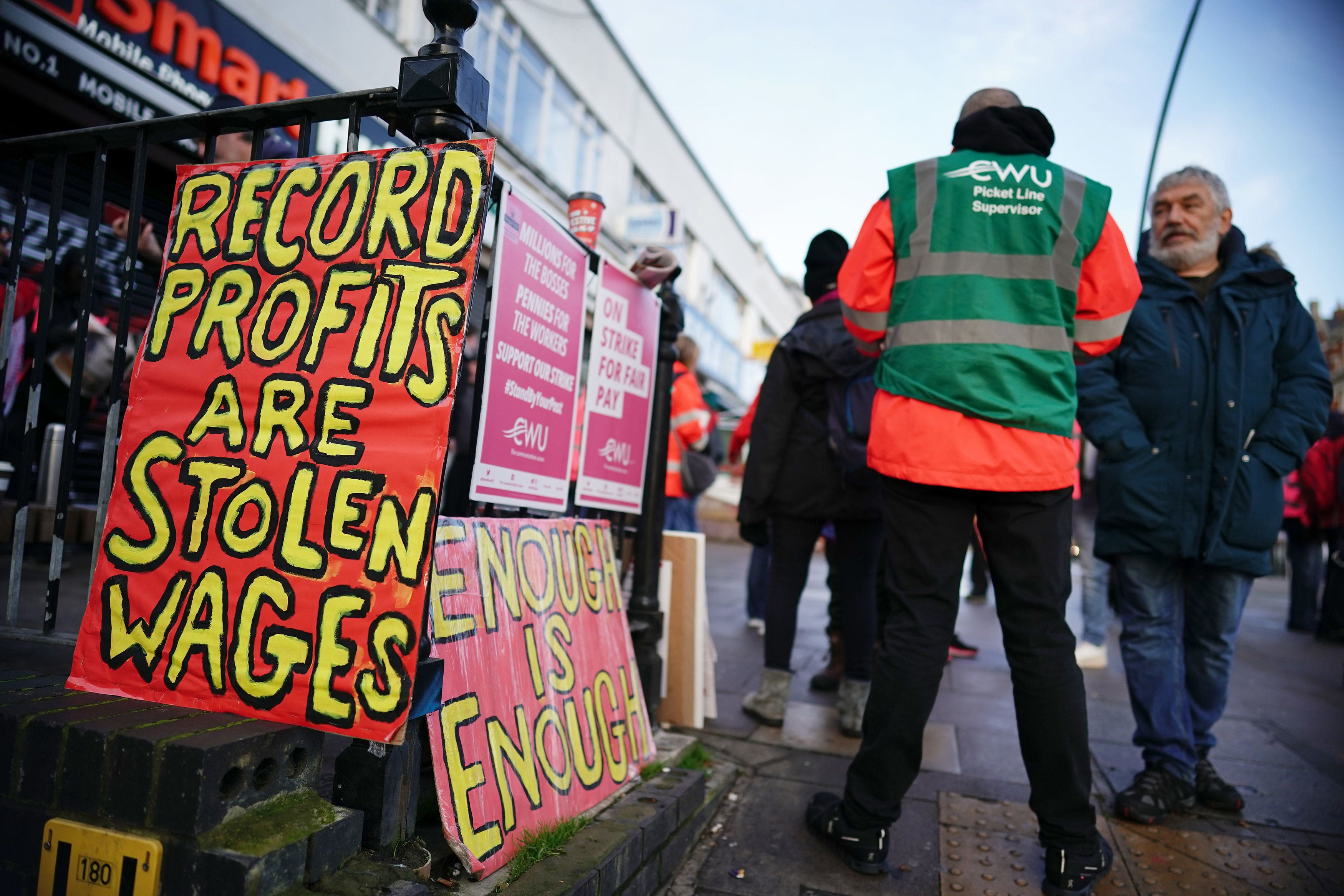 Royal Mail workers and university lecturers will continue with a strike on Friday in long running disputes over pay, pensions, jobs and conditions (Aaron Chown/PA)