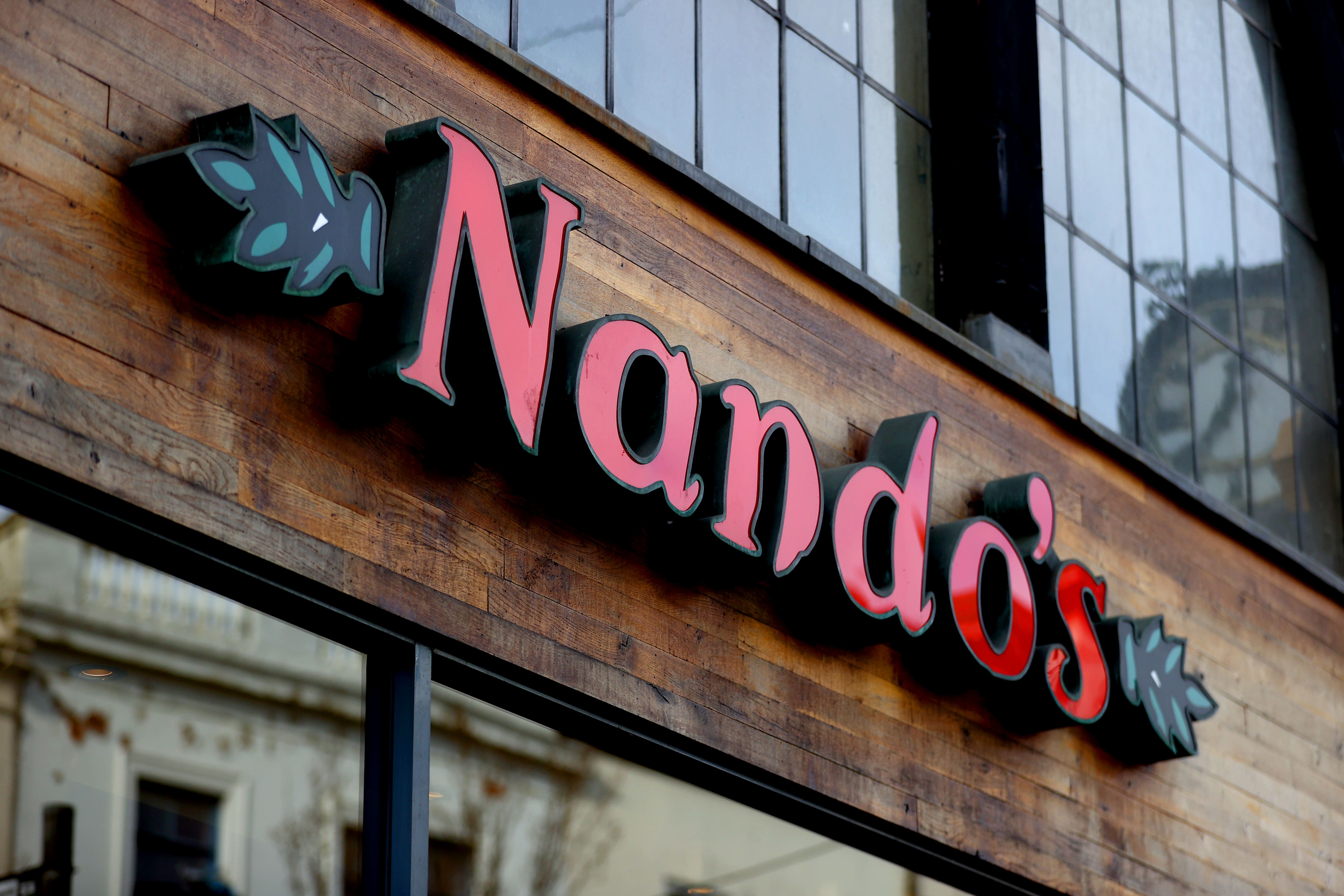 Nando’s has heavily cut its losses but said its return to profit has been slowed by inflationary pressures (Tim Goode/PA)