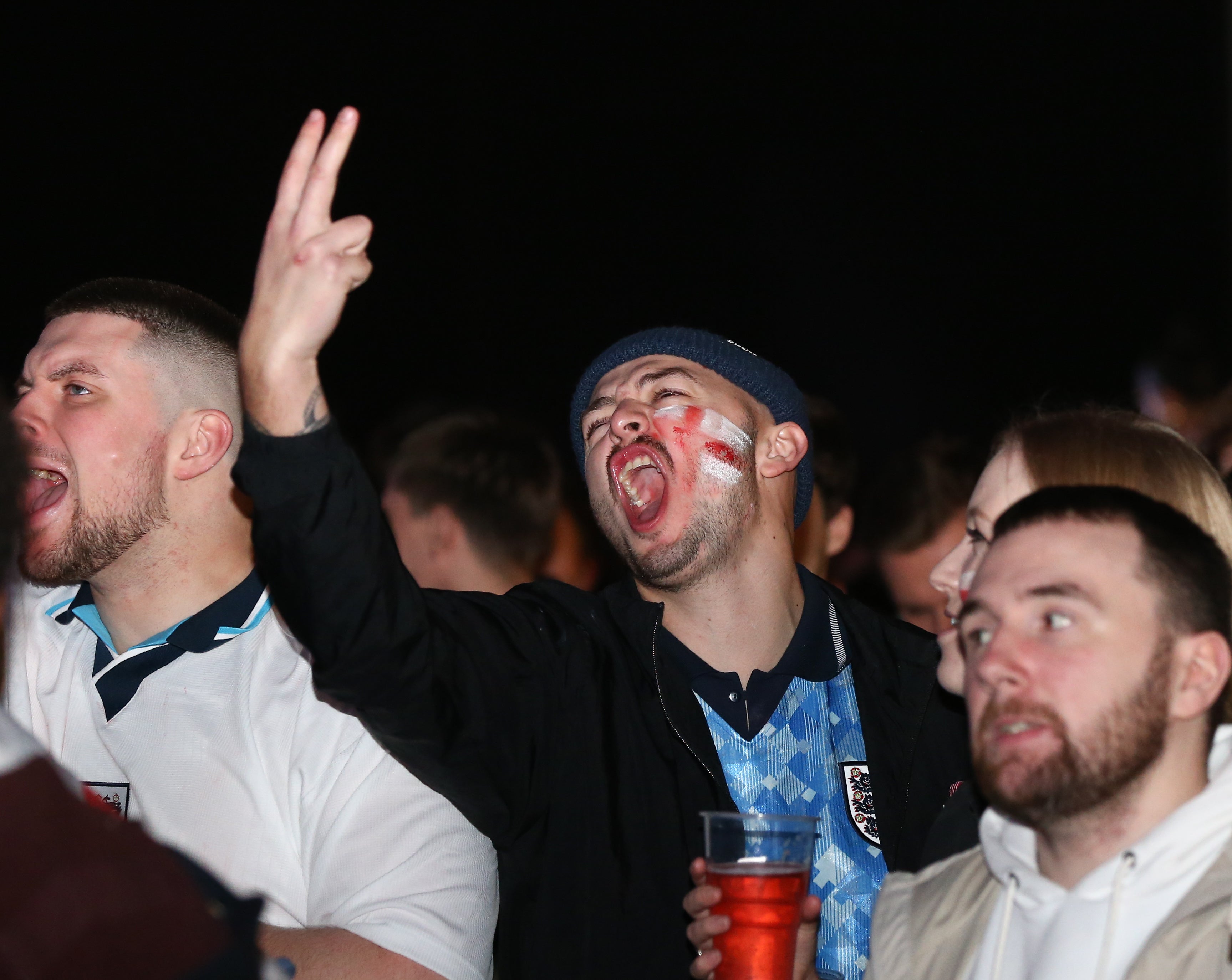 Fans react during the to the match between England and the USA at the 4TheFans fan park in Manchester, UK