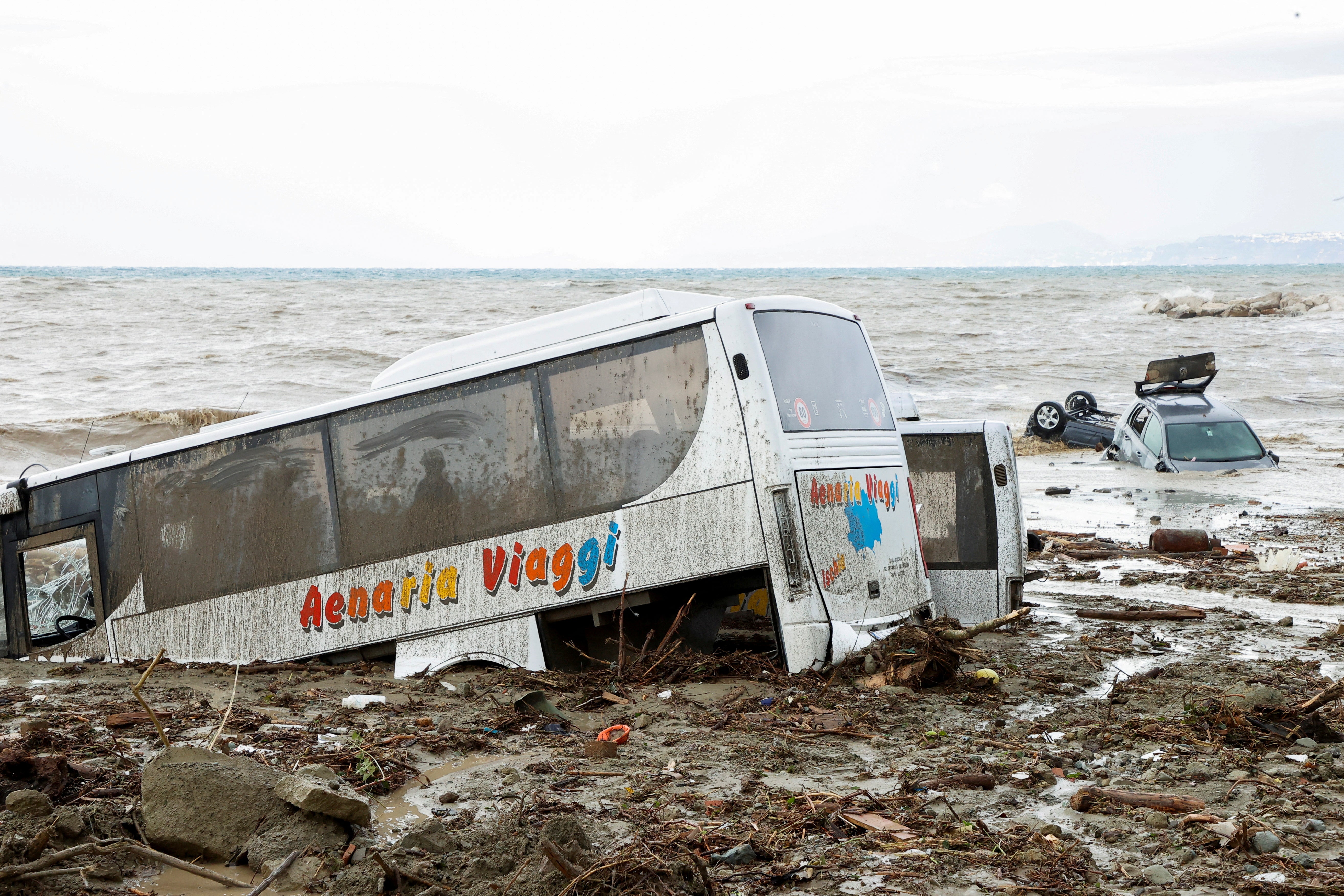 Cars and local tour buses wash out to sea