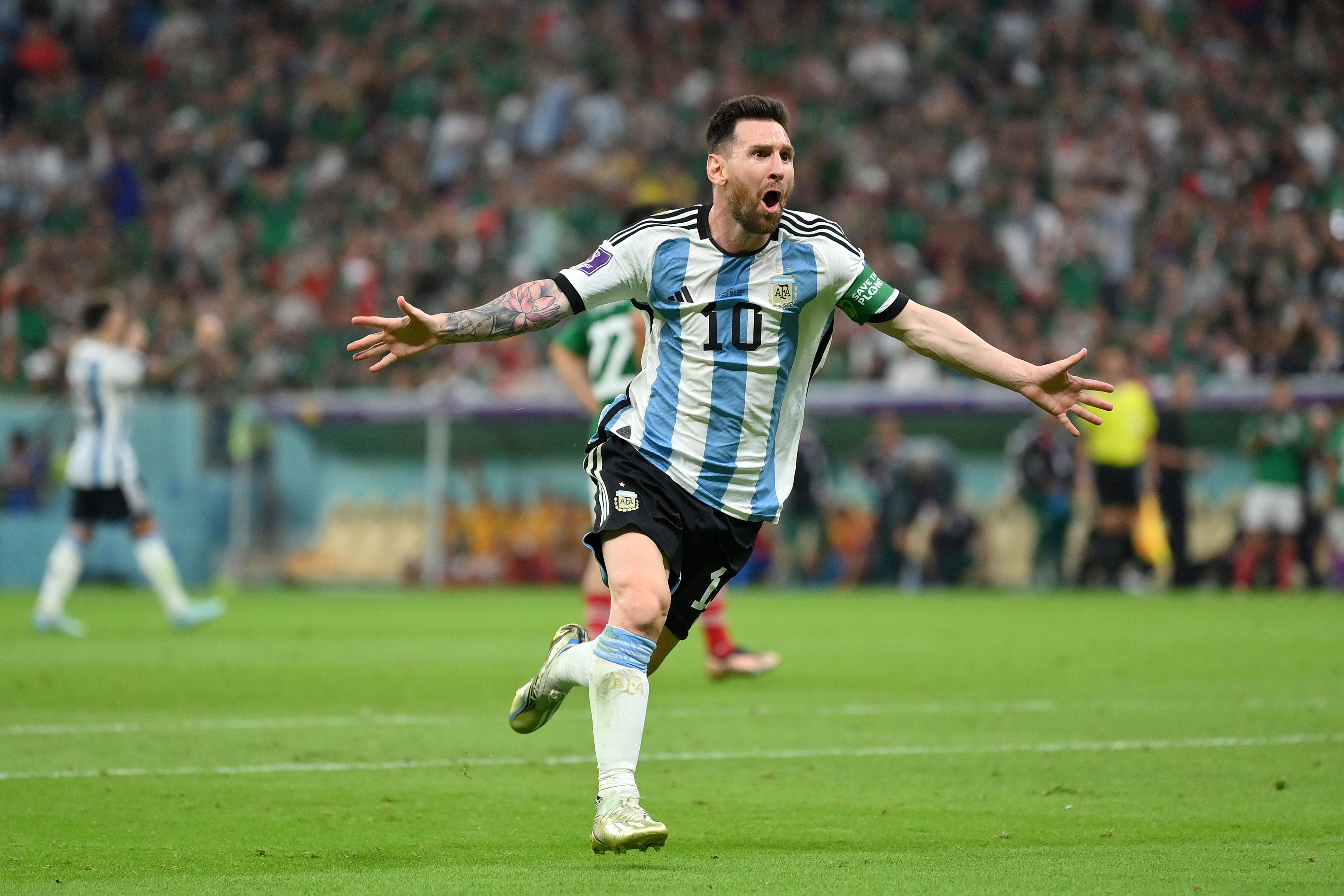 Messi celebrates after scoring against Mexico