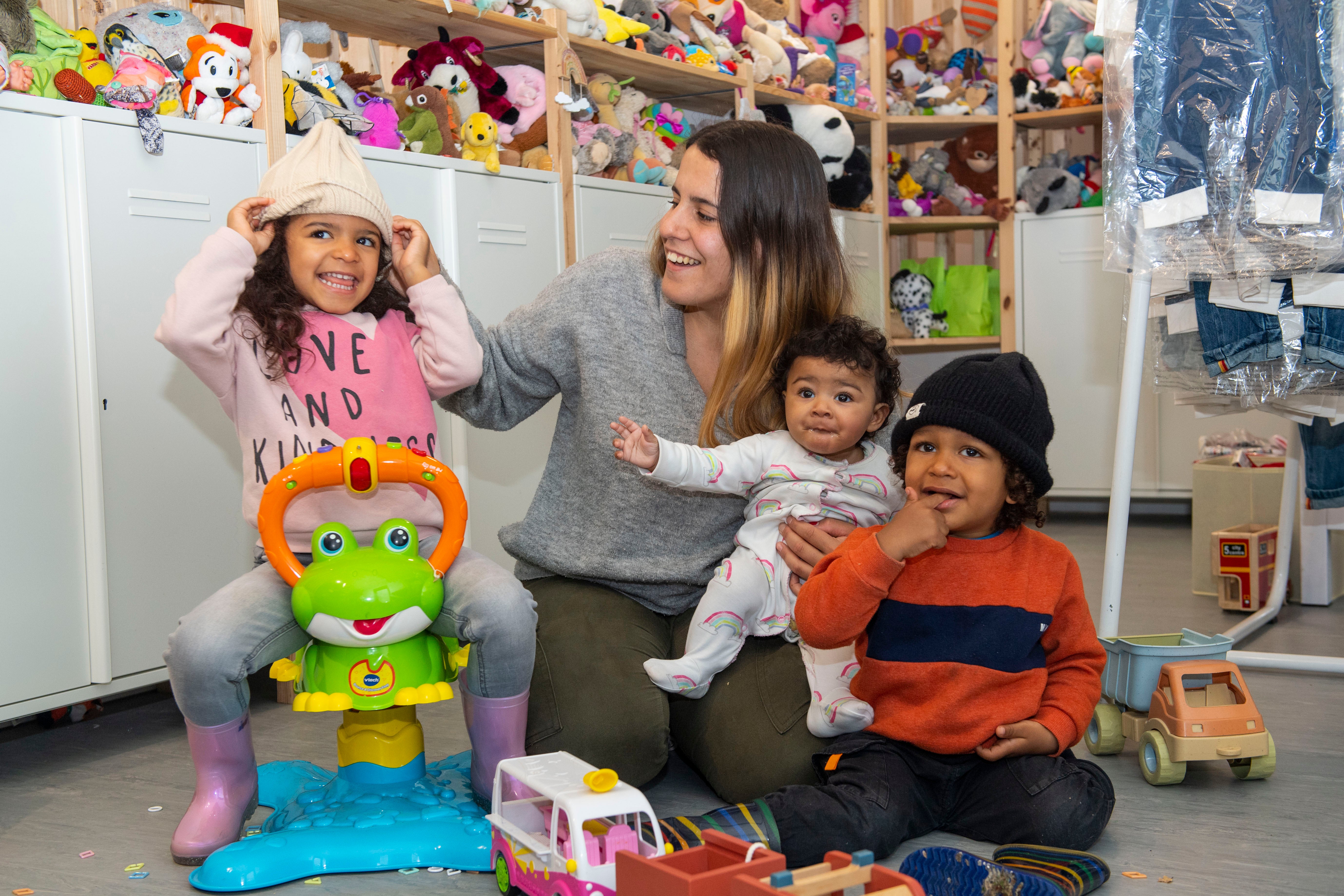 Ines with her children, aged three, two and five months