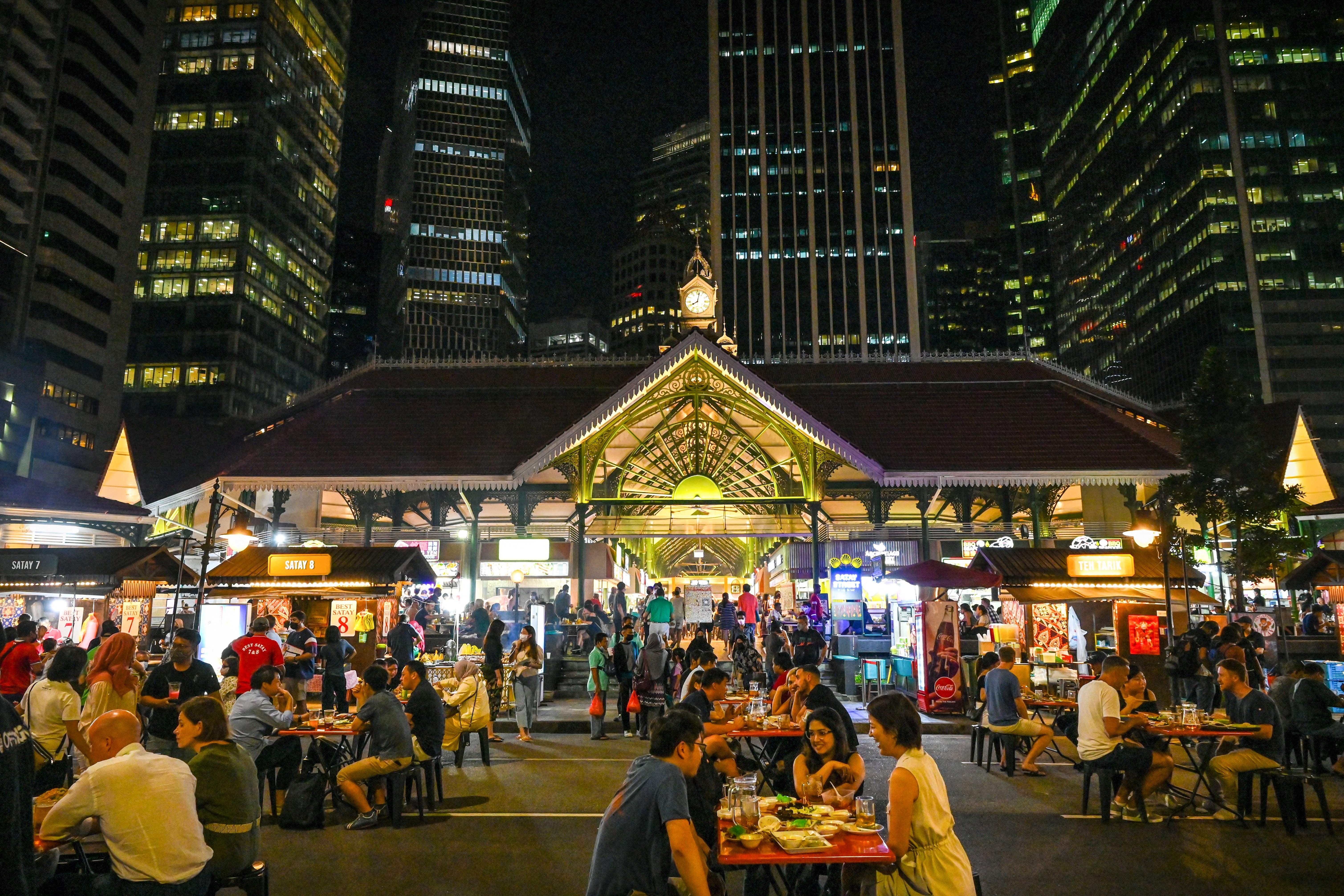 Light meal: diners eat al fresco at Lau Pa Sat in the city centre