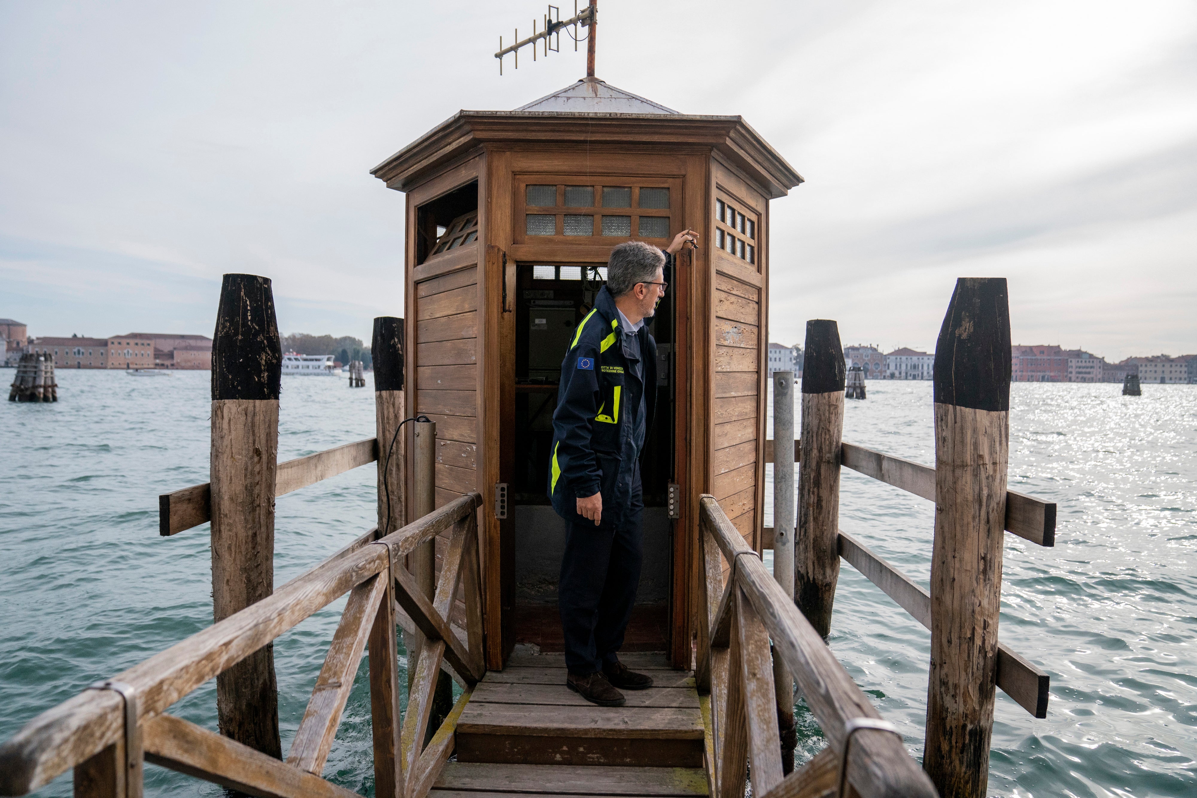 Alvise Papa, the director of Venice's weather prediction service, looks out from a station where the tides are measured