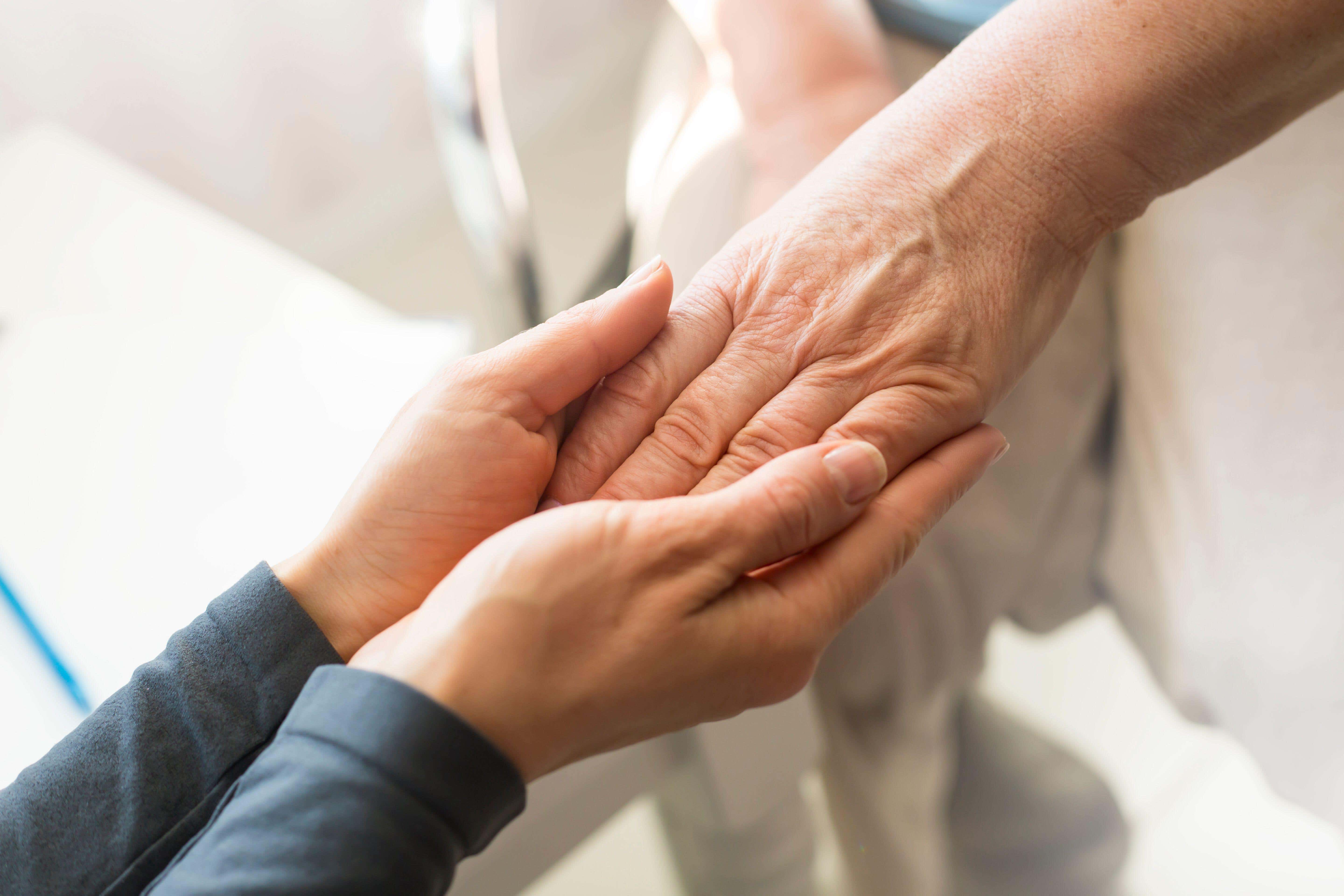 Close-up of two people’s hands (Tutatama/Alamy Stock Photo)