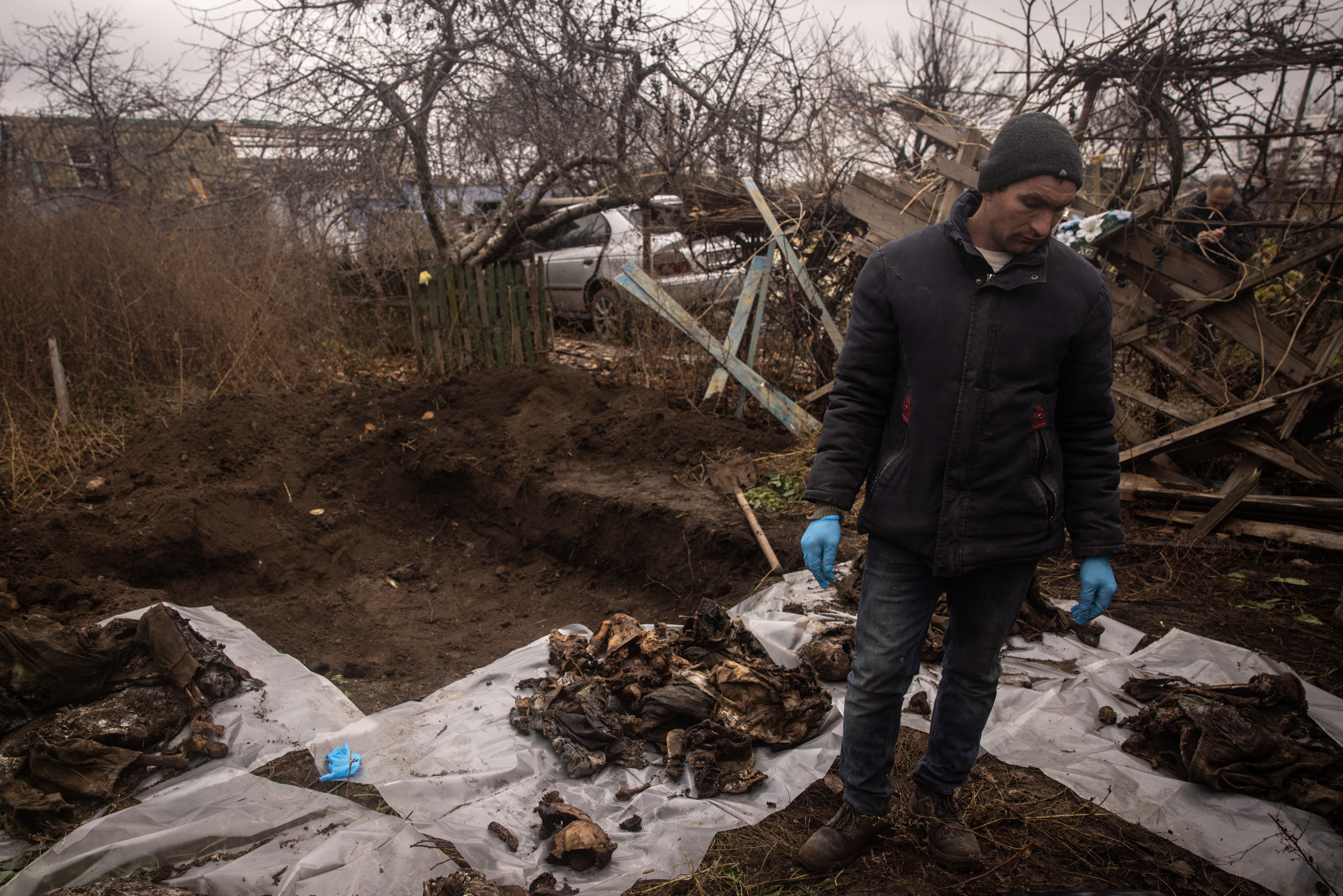 Ukrainian authorities exhume a burial site containing the bodies of six civilians that were executed by Russian forces