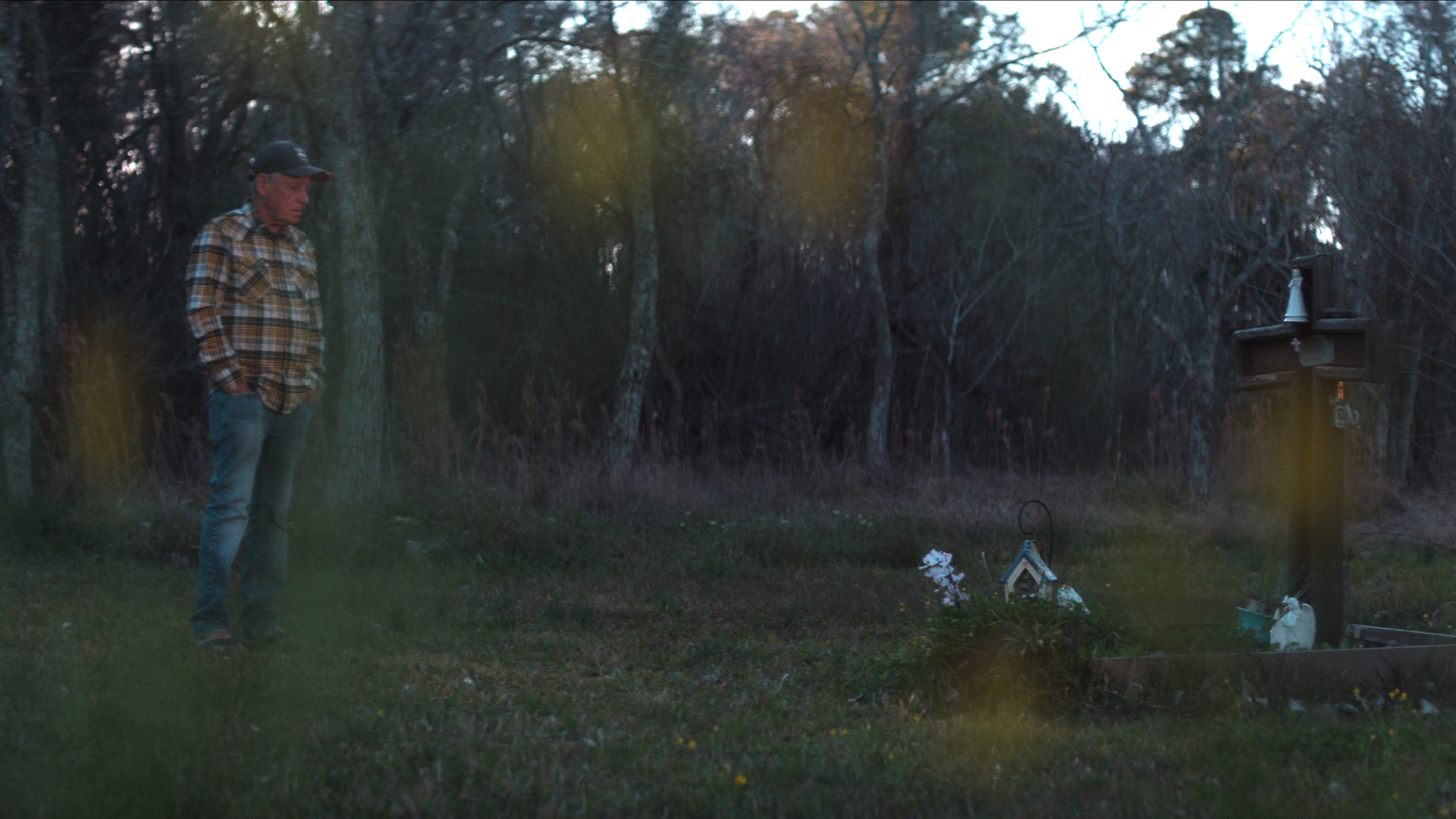 Tim Miller, whose daughter Laura was found in the area nicknamed the Texas Killing Fields, stands near the victim memorials in the desolate Calder Road region near Houston