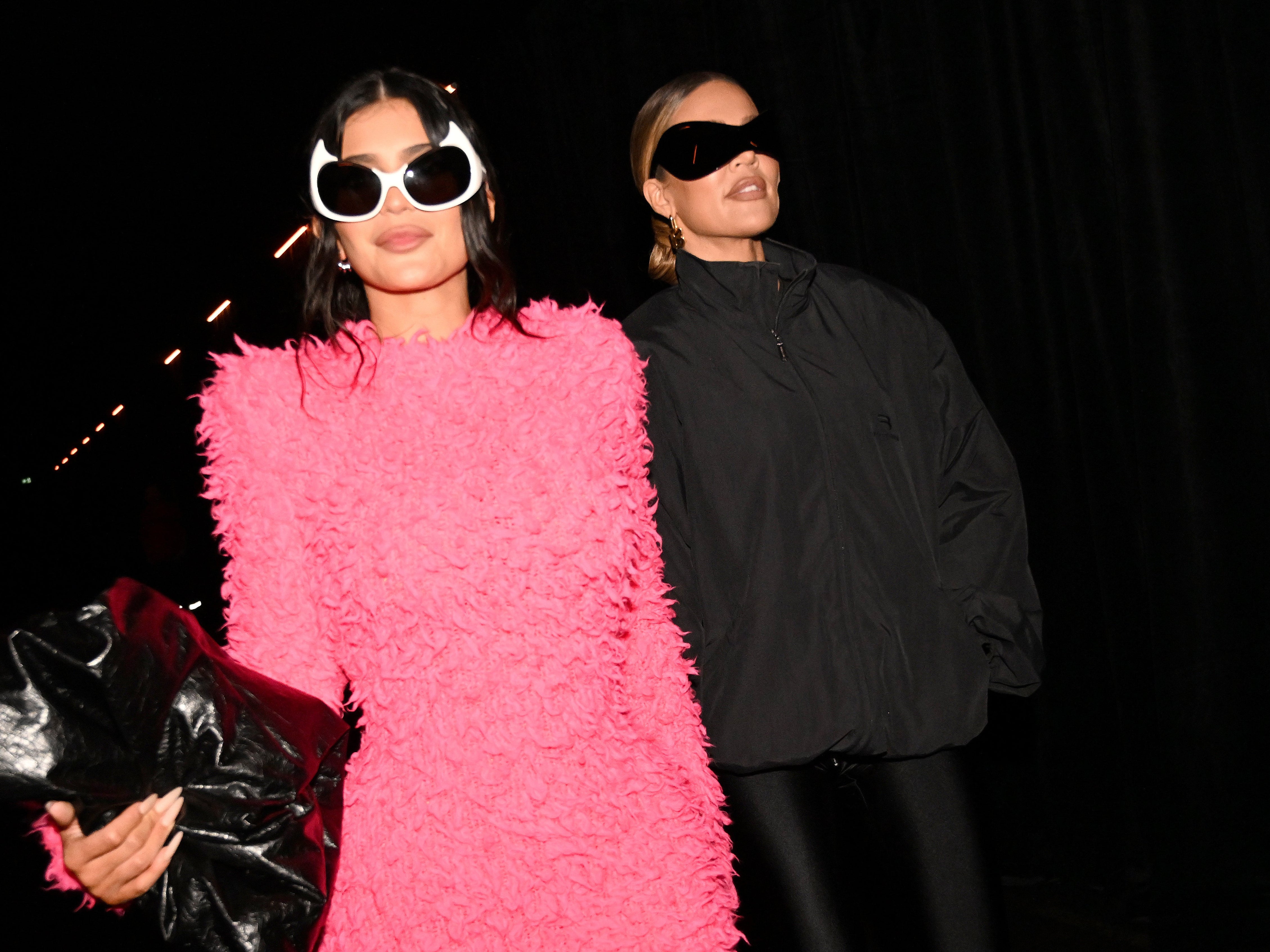 Kylie Jenner and Khloe Kardashian arriving at the SS23 Balenciaga show in Paris.