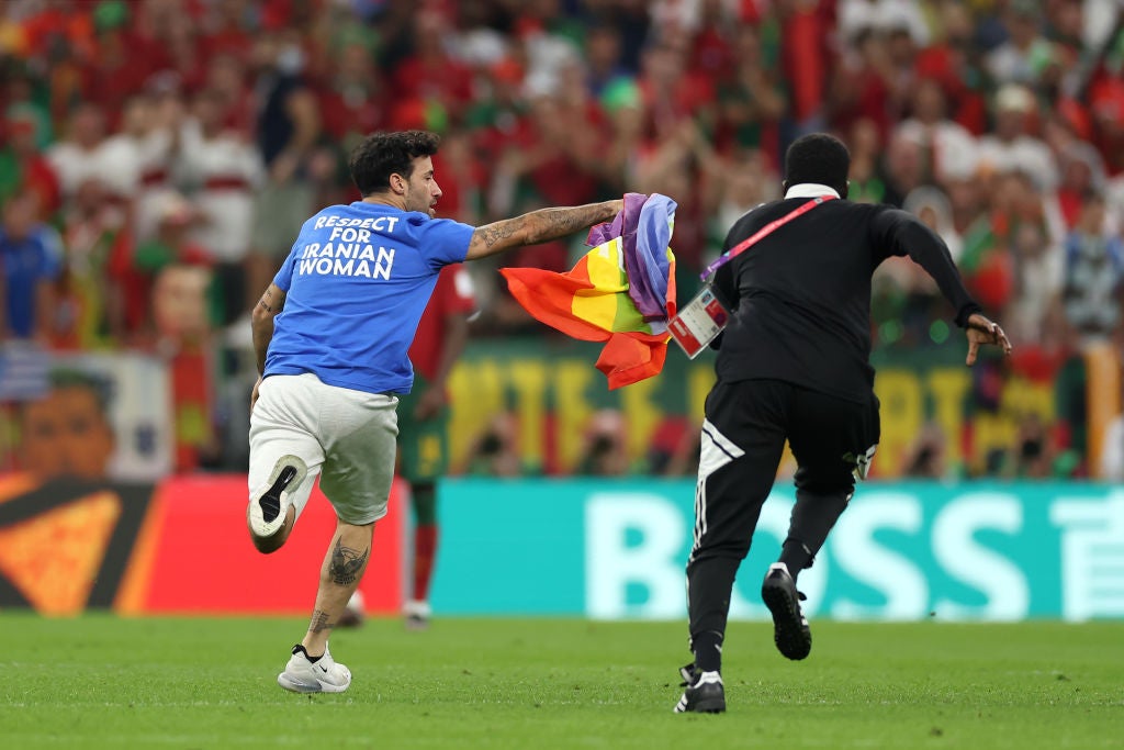 A pitch invader carrying a rainbow flag stopped play on Monday