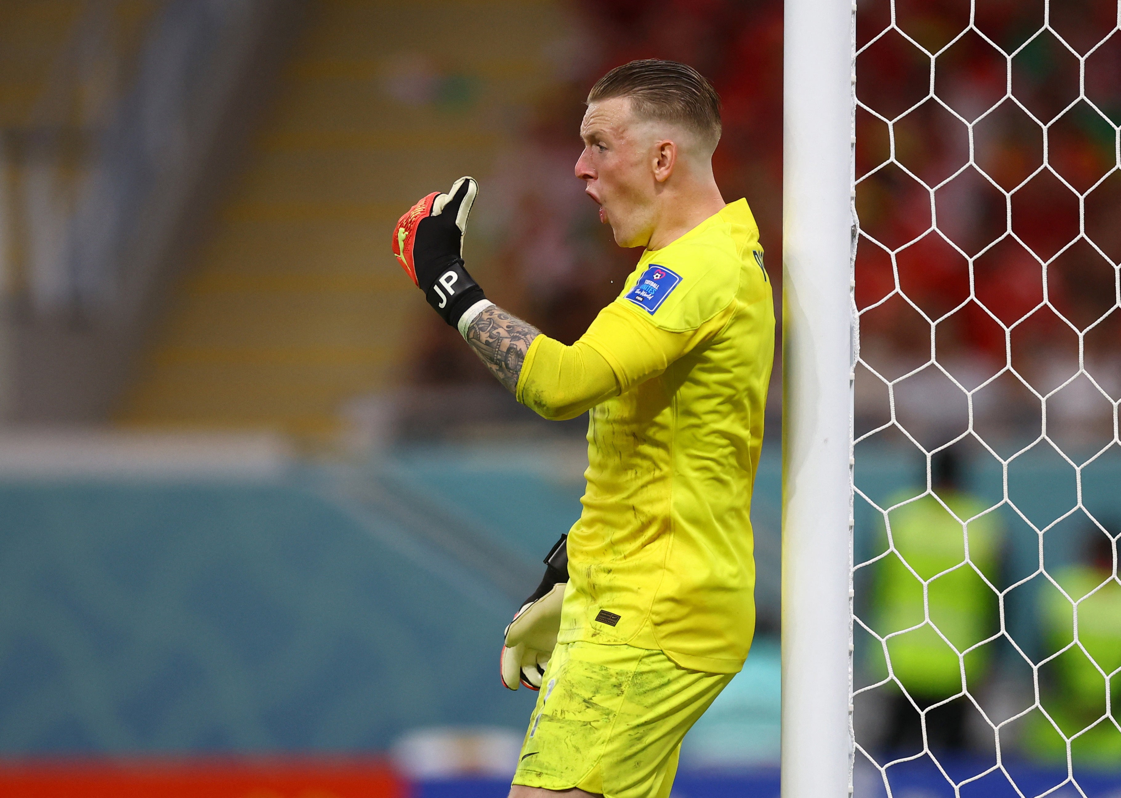 Pickford tries to organise the England players ahead of a Wales free kick