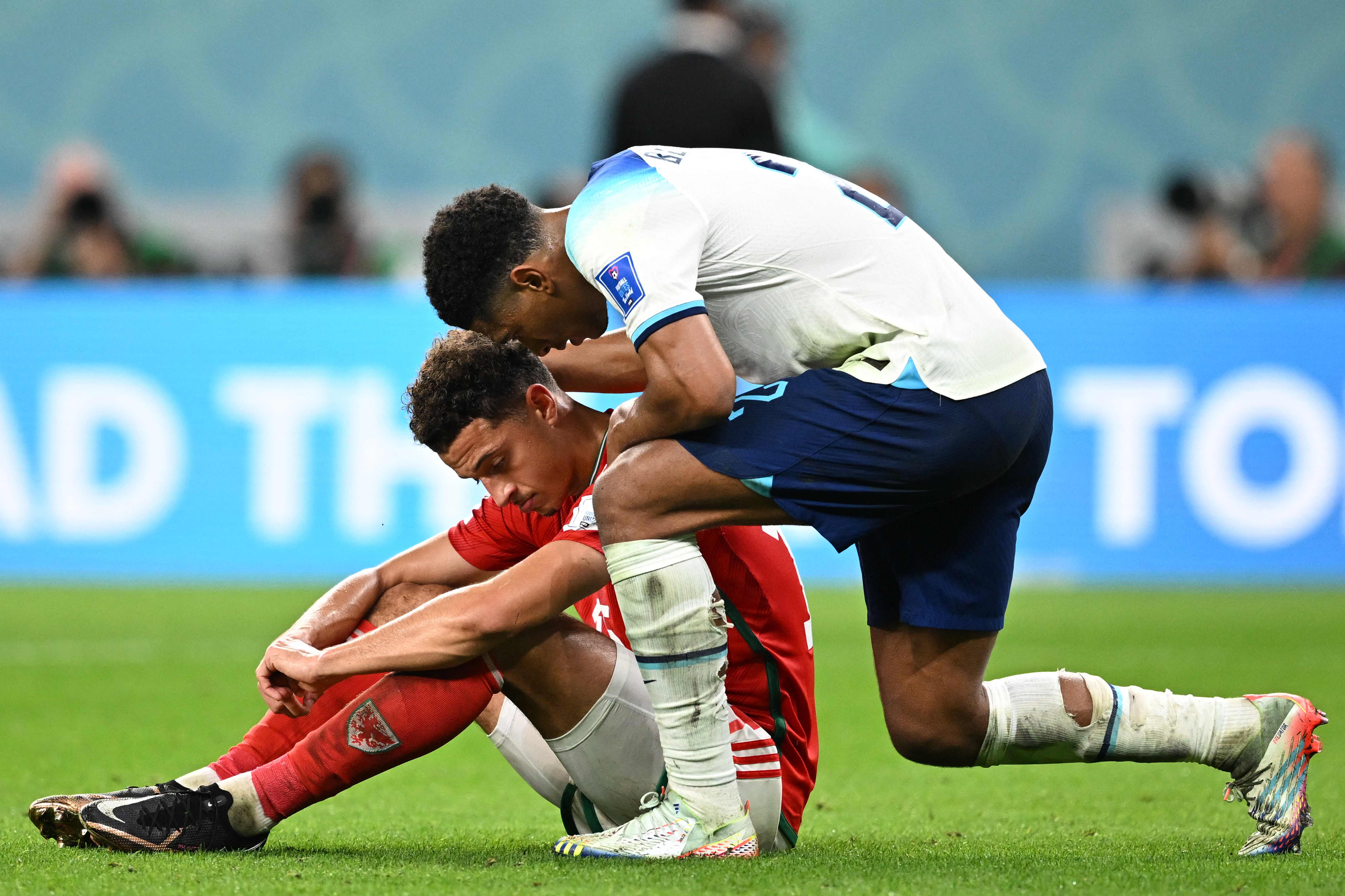 Bellingham comforts Ethan Ampadu after the match