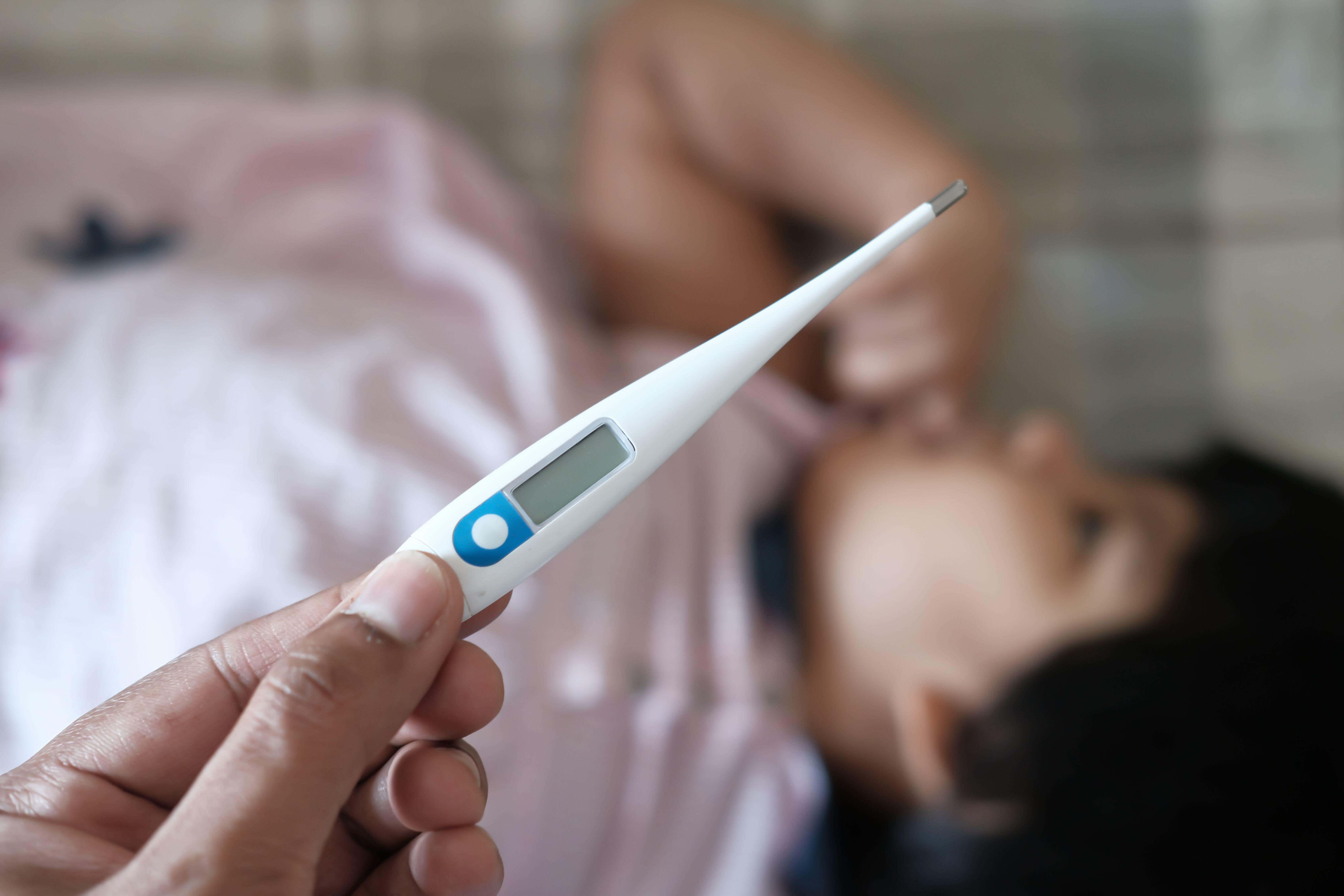 A child having their temperature taken