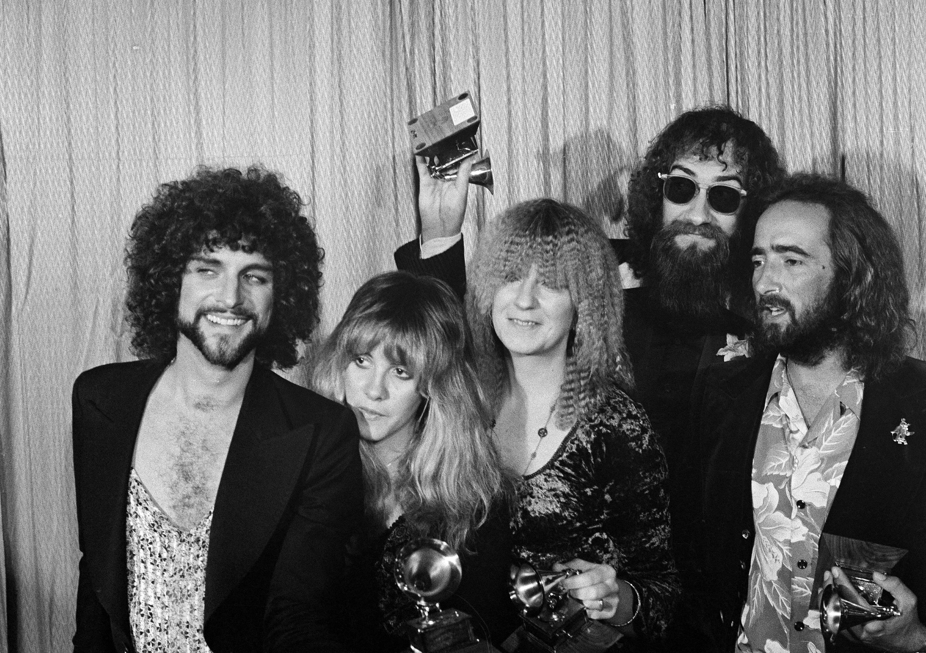 From left: Lindsey Buckingham, Stevie Nicks, Christine McVie, Mick Fleetwood, and John McVie pose with their Album of the Year Grammy Award for ‘Rumours’ in Los Angeles, 23 February 1978