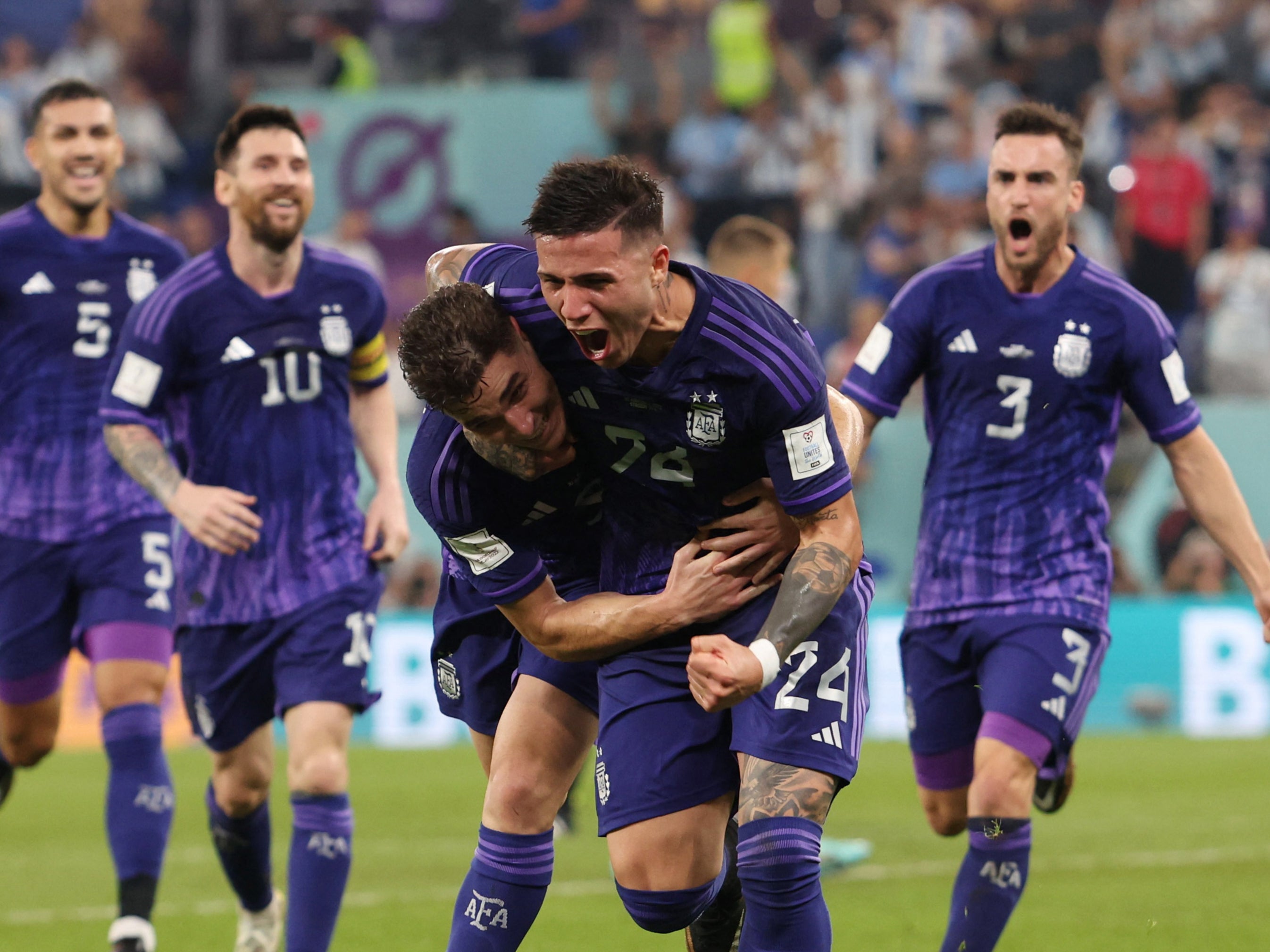 Julian Alvarez is embraced after doubling Argentina’s lead