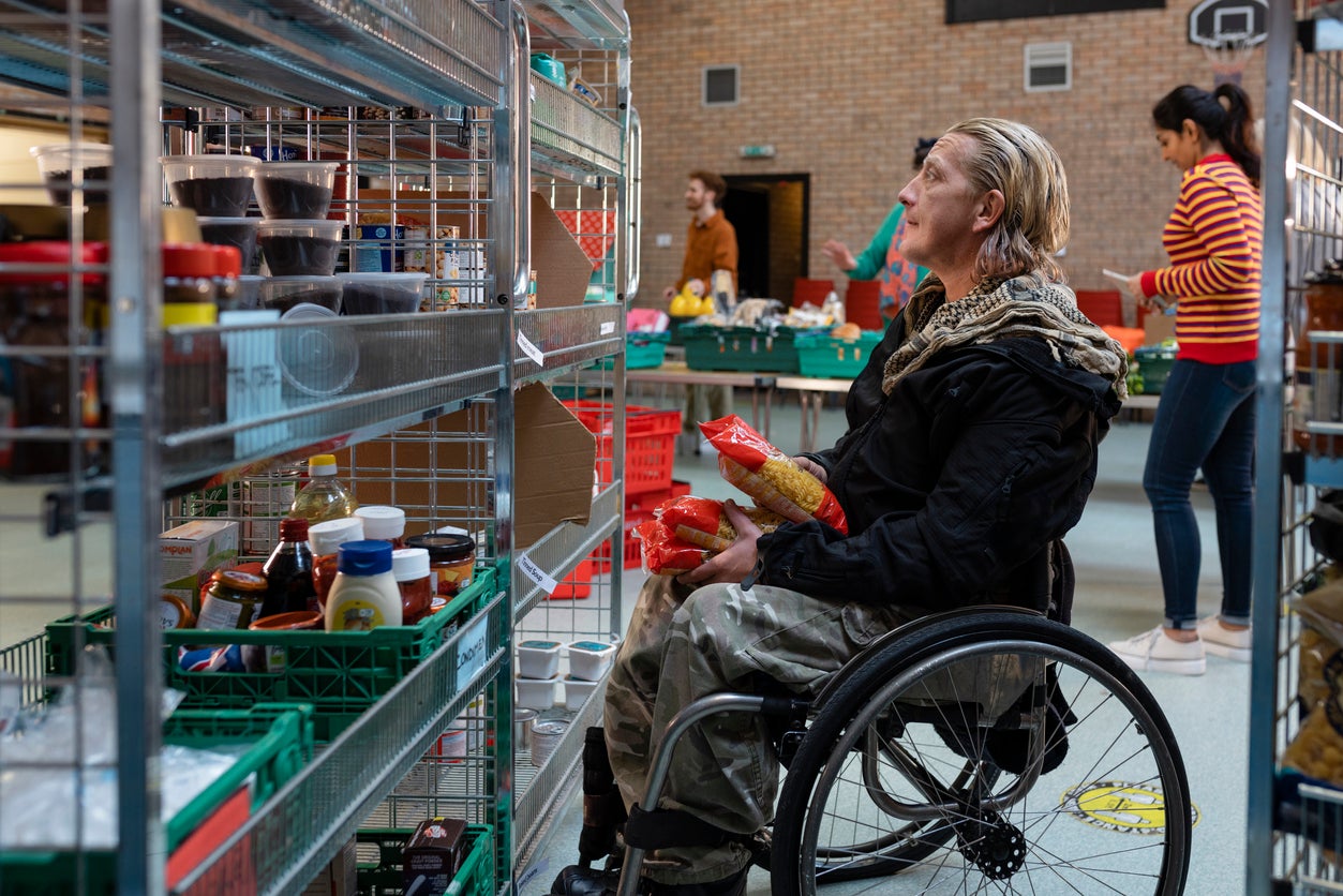 Volunteer organising donations at a food bank in the north east of England