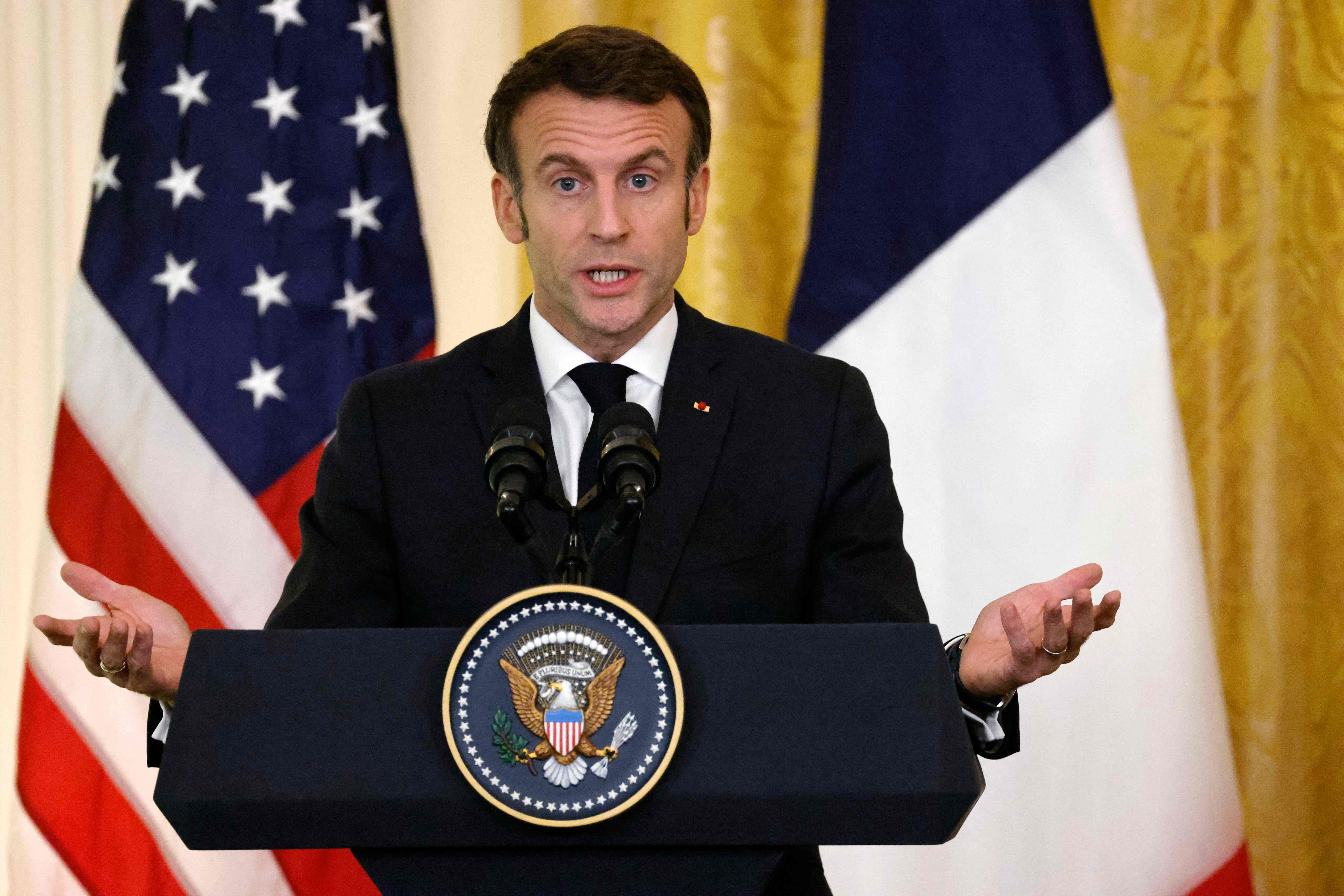 French President Emmanuel Macron speaks during a joint press conference with US President Joe Biden in the East Room of the White House in Washington, DC, on December 1, 2022