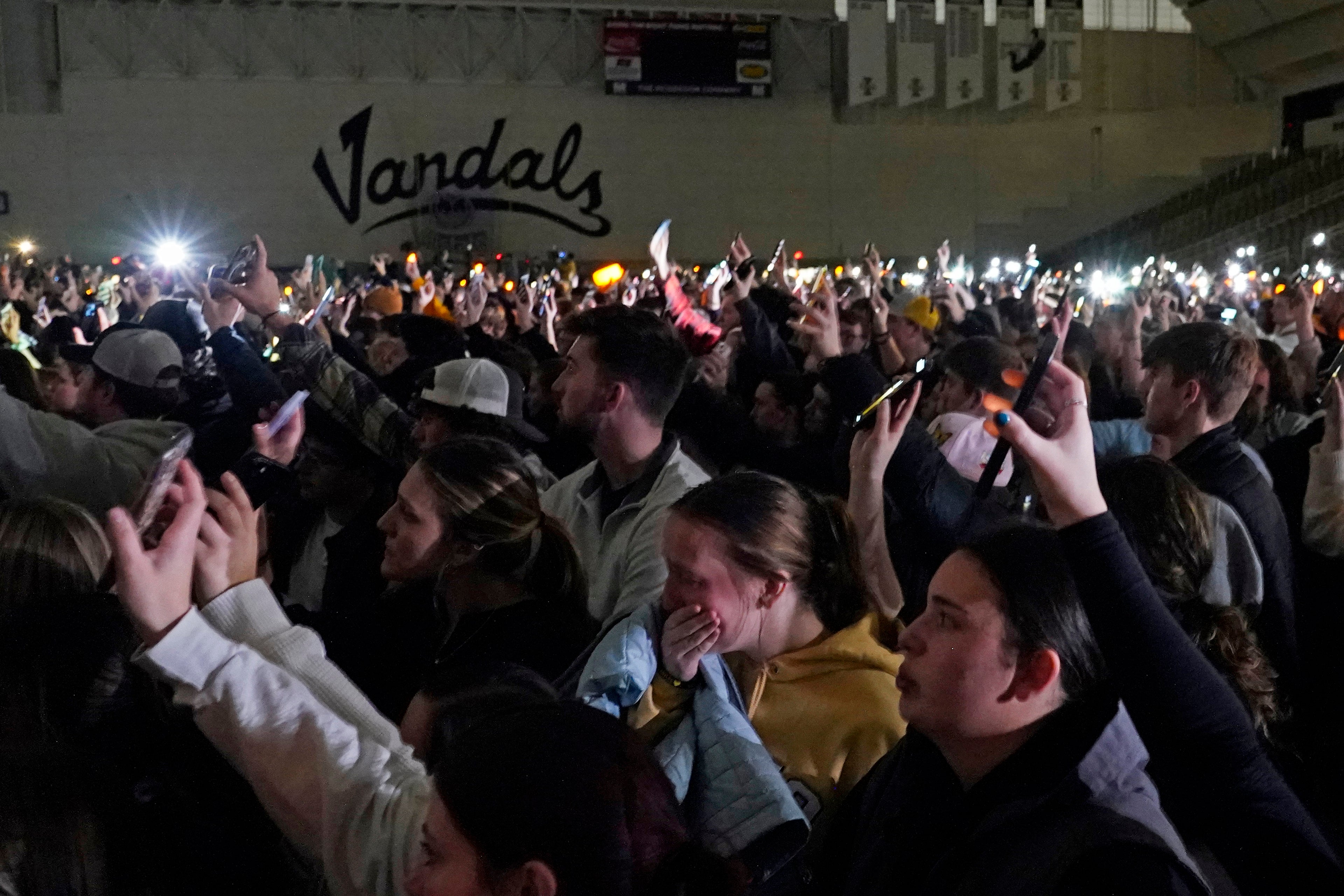 Moscow residents attend a vigil in honour of the four murdered students