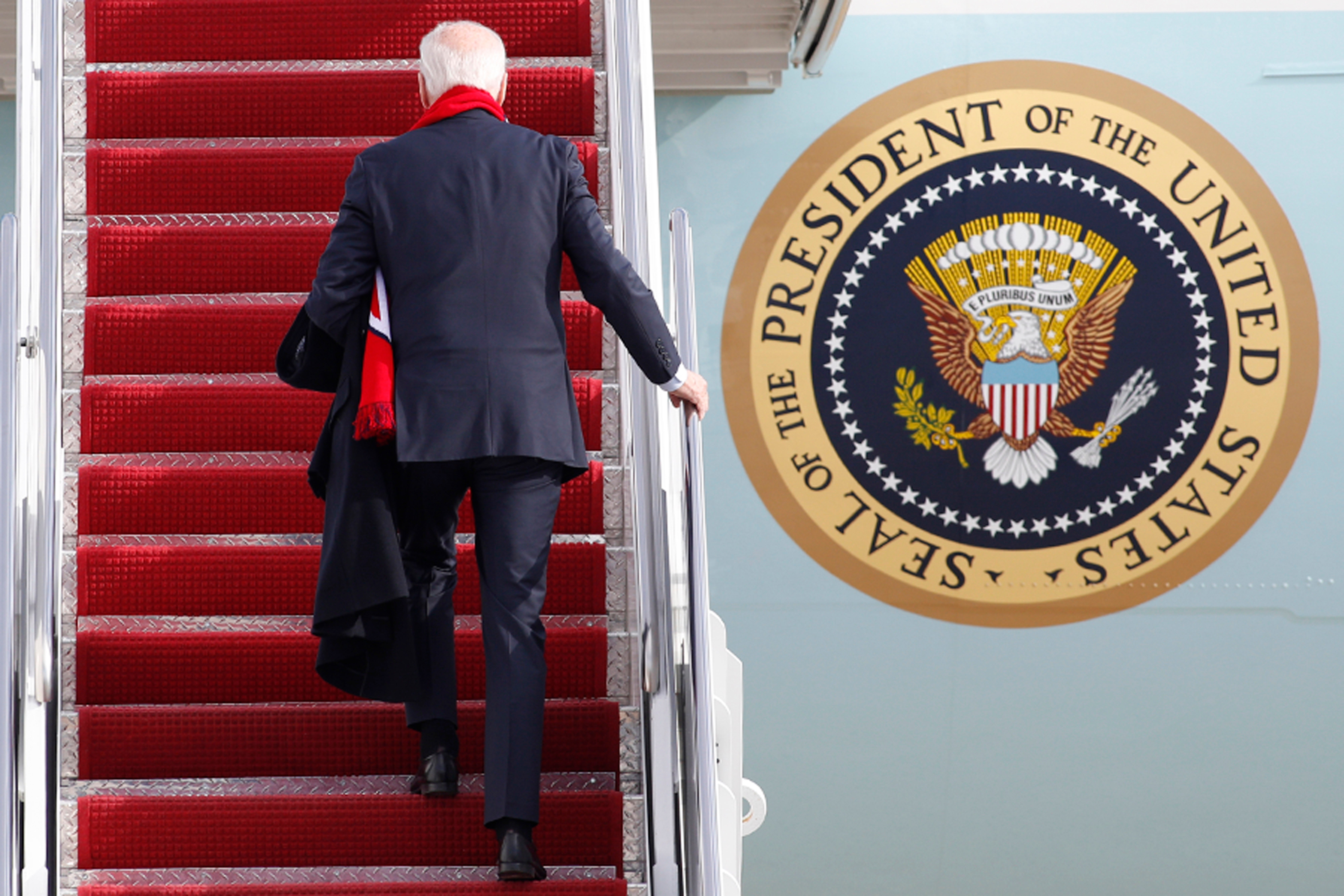 President Joe Biden walks up the stairs of Air Force One at Andrews Air Force Base, Md., Friday, Dec. 2, 2022