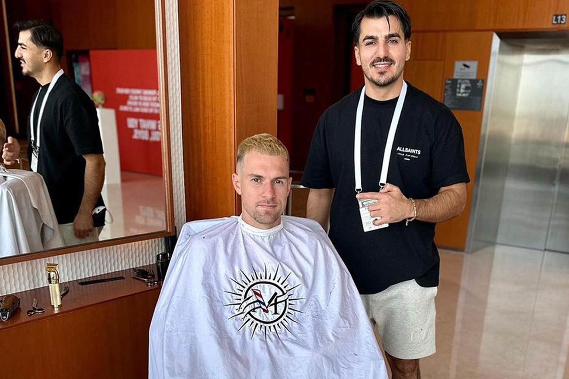 Barber Rebin Rob with Aaron Ramsey of Wales (Rebin Rob/PA)