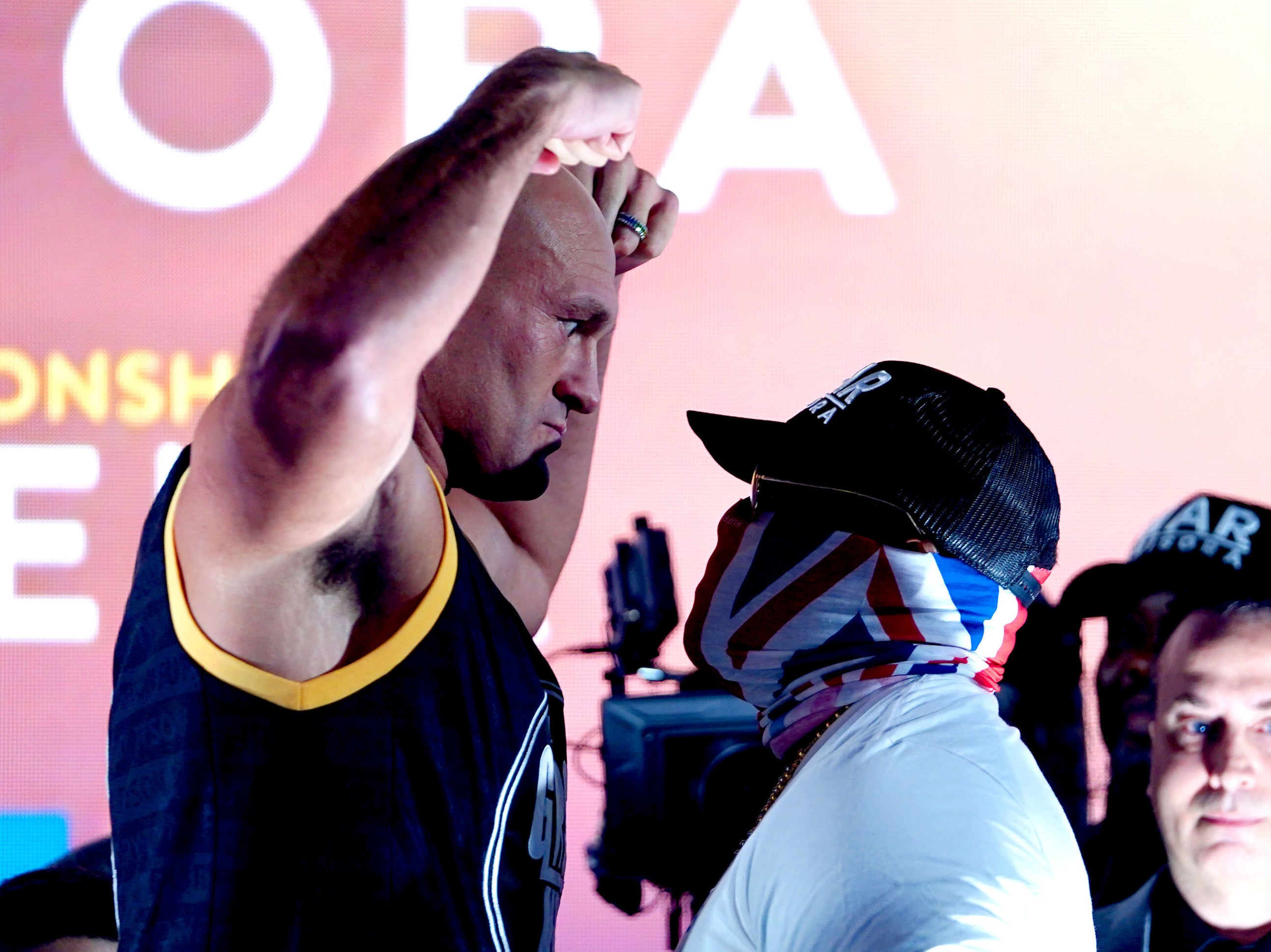 Tyson Fury faces off with challenger Derek Chisora at the weigh-ins for their title fight