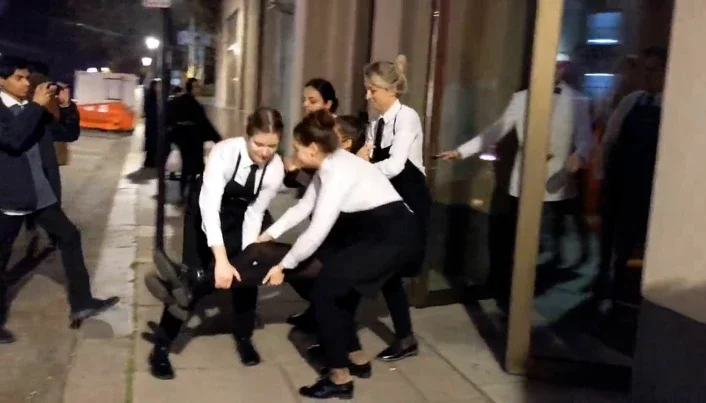 Restaurant staff remove protesters in London