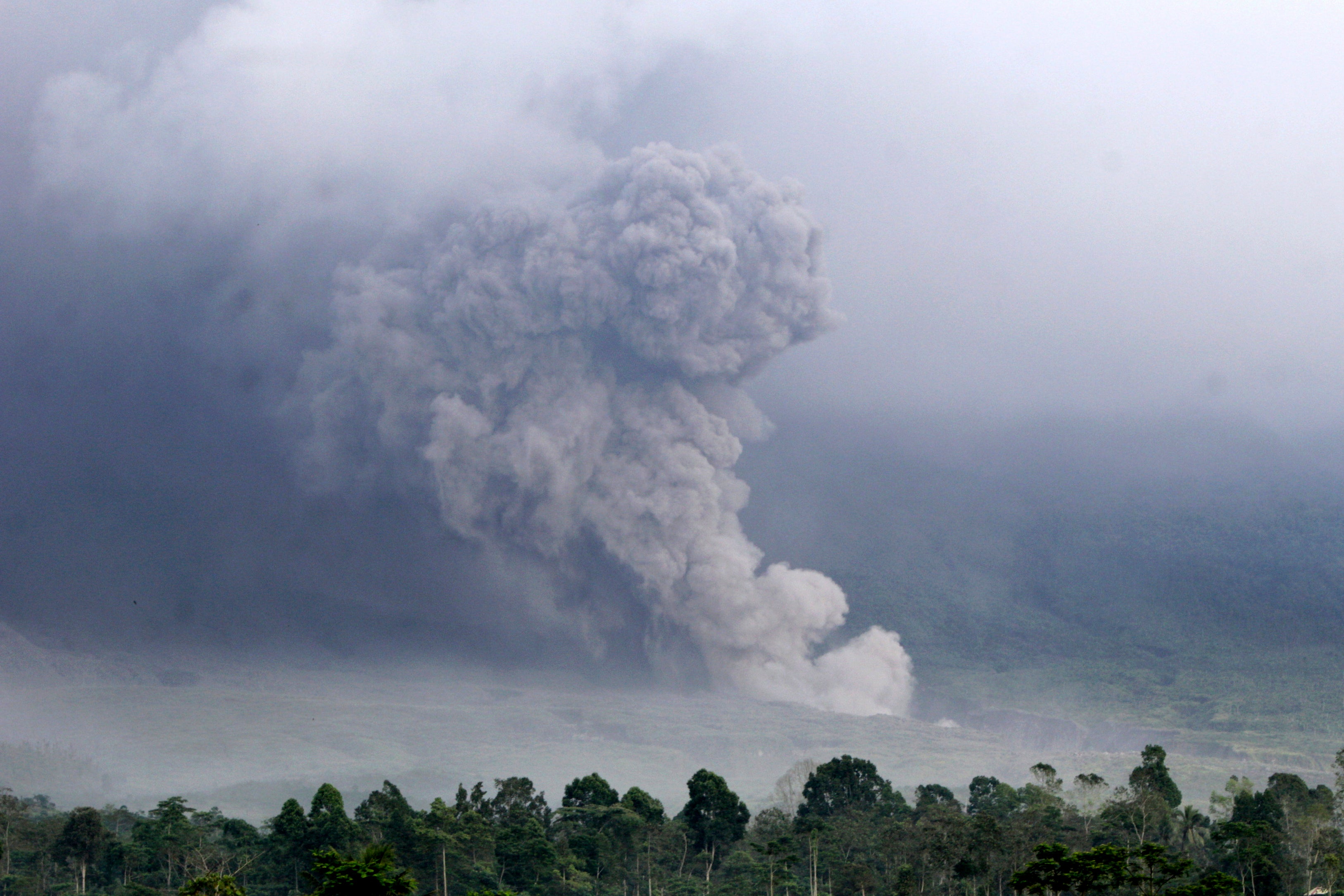 Indonesia’s highest volcano erupts as evacuations carried out on most densely populated island
