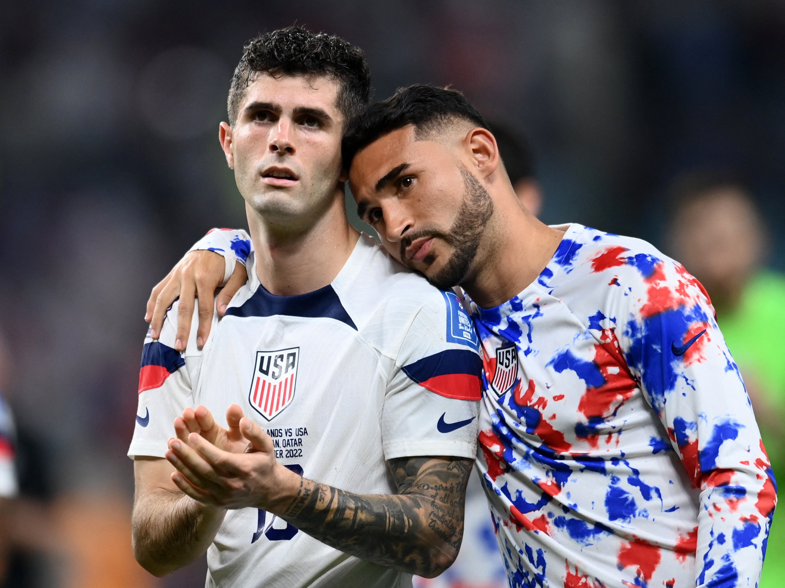 Christian Pulisic and Cristian Roldan look dejected after the USA’s World Cup exit