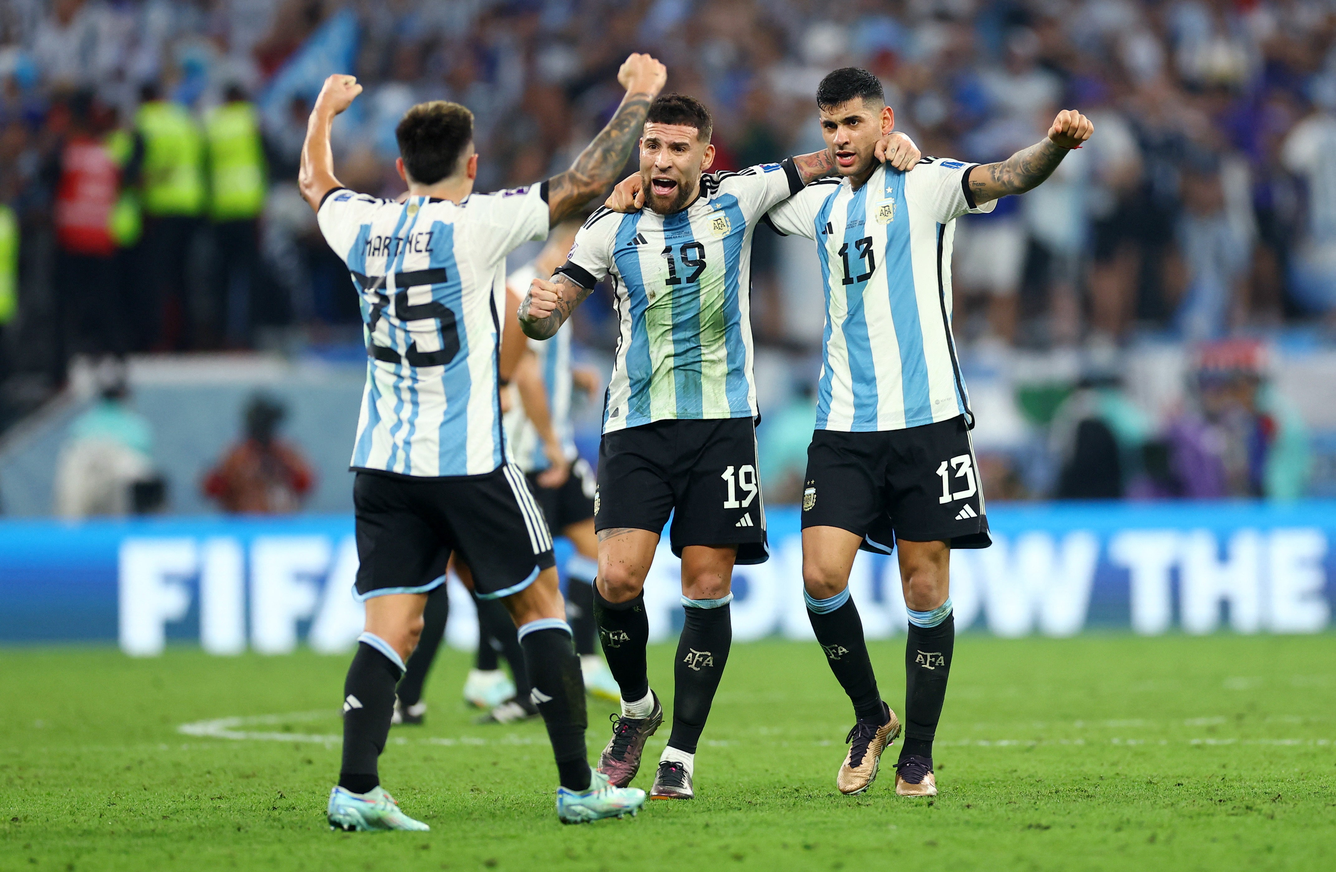 Argentina's Lisandro Martinez, Nicolas Otamendi and Cristian Romero celebrate