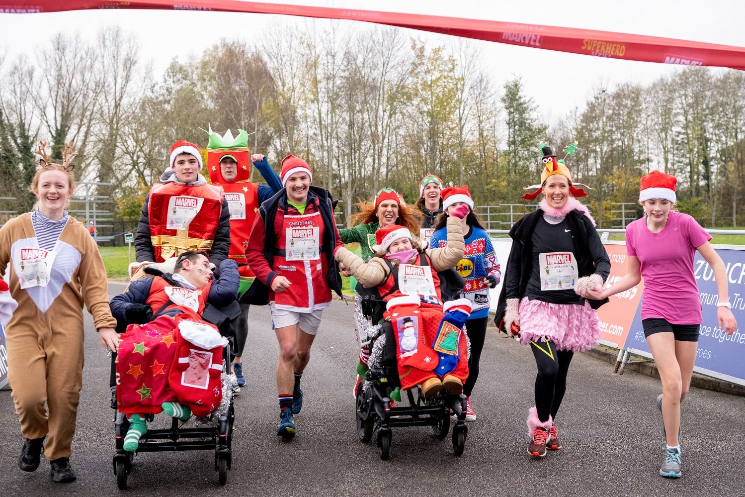 Families taking part in the superhero sporting event (Marvel)