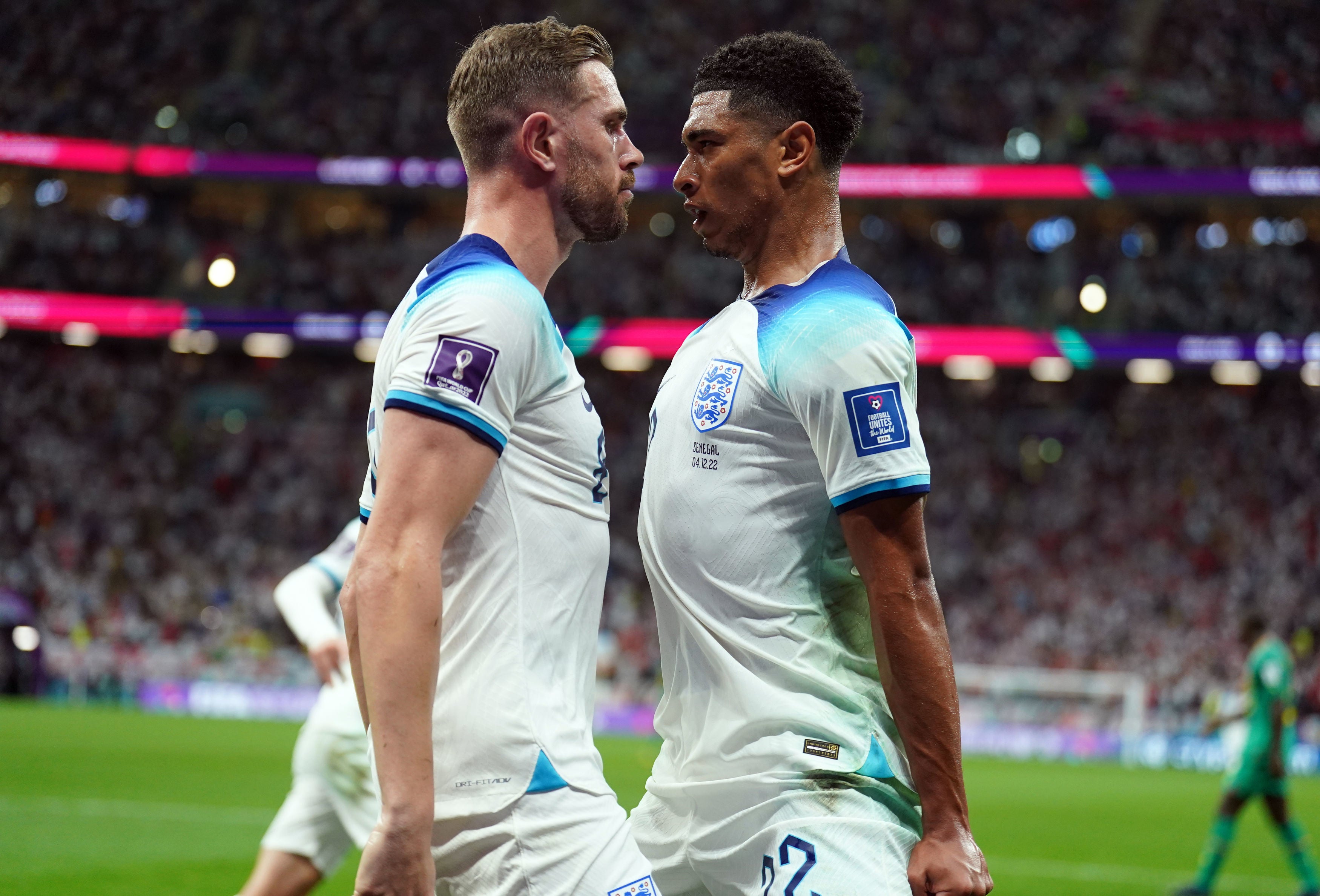 Jordan Henderson celebrates scoring England’s opening goal with Jude Bellingham, who made the set-up