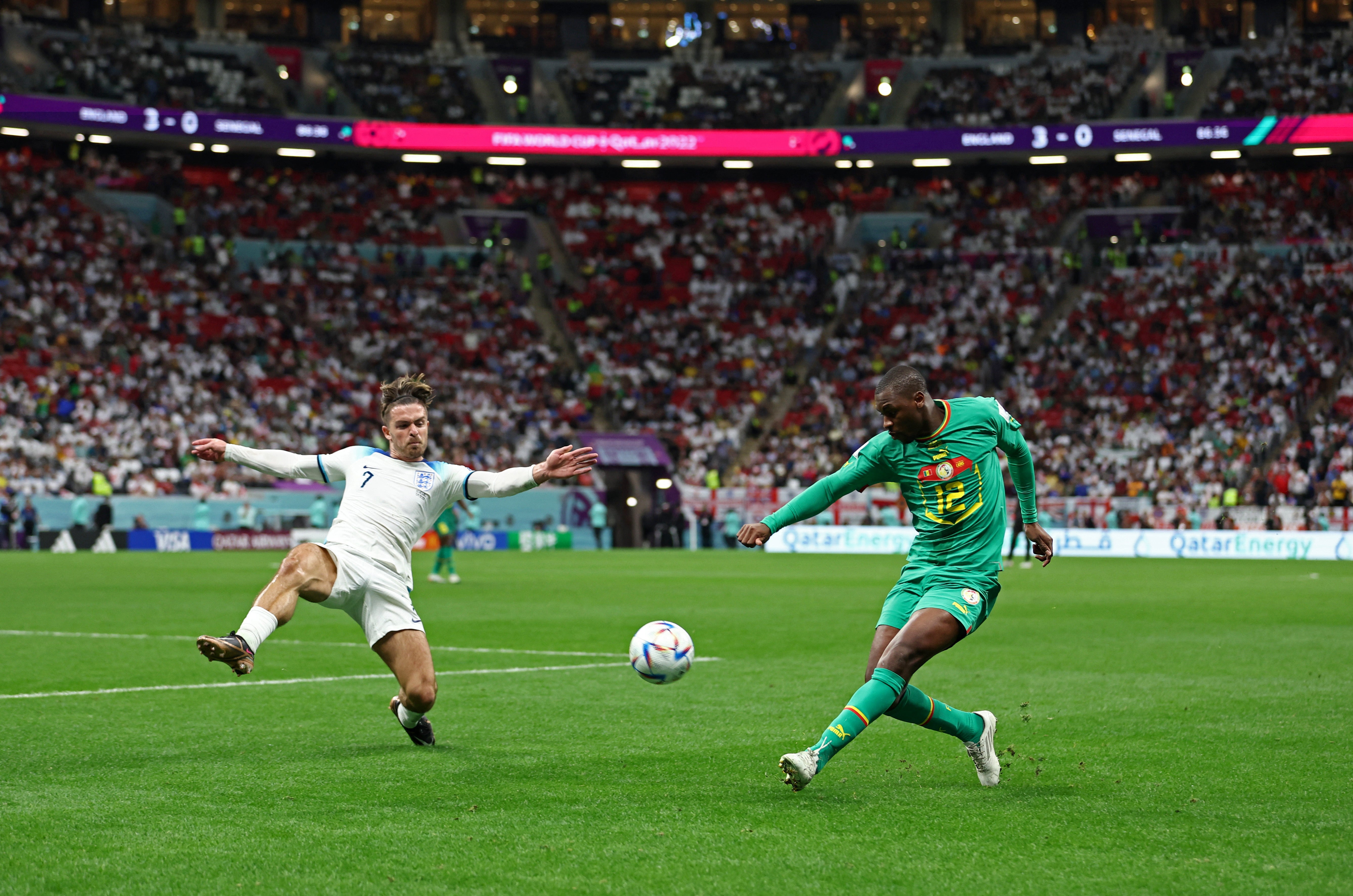 Jack Grealish faces off against Senegal’s Fode Ballo-Toure